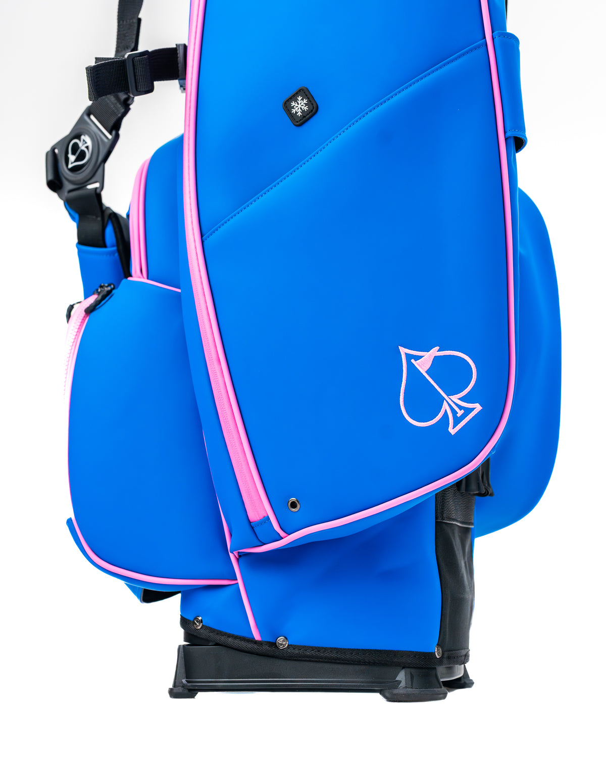 Bold blue raspberry golf bag with pink accents and a spade logo, designed for stylish and functional on-course performance.