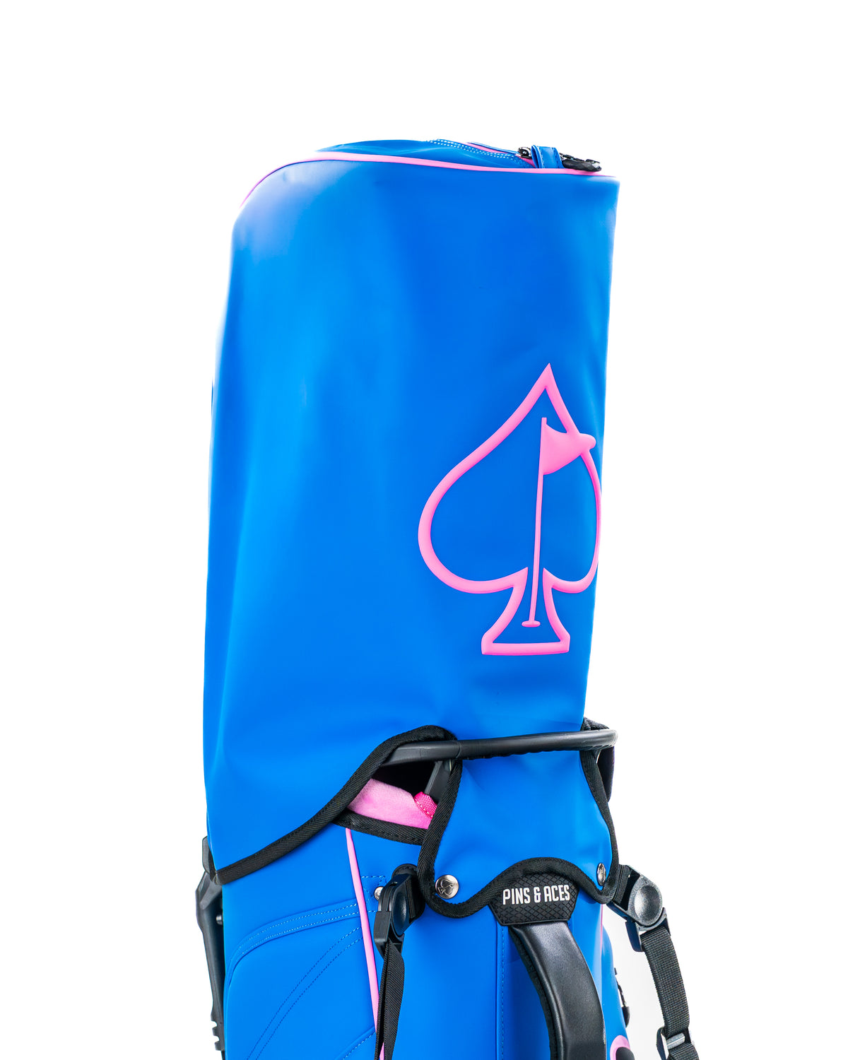 Bold blue raspberry golf bag featuring a prominent pink spade logo, designed for stylish and functional play on the course.