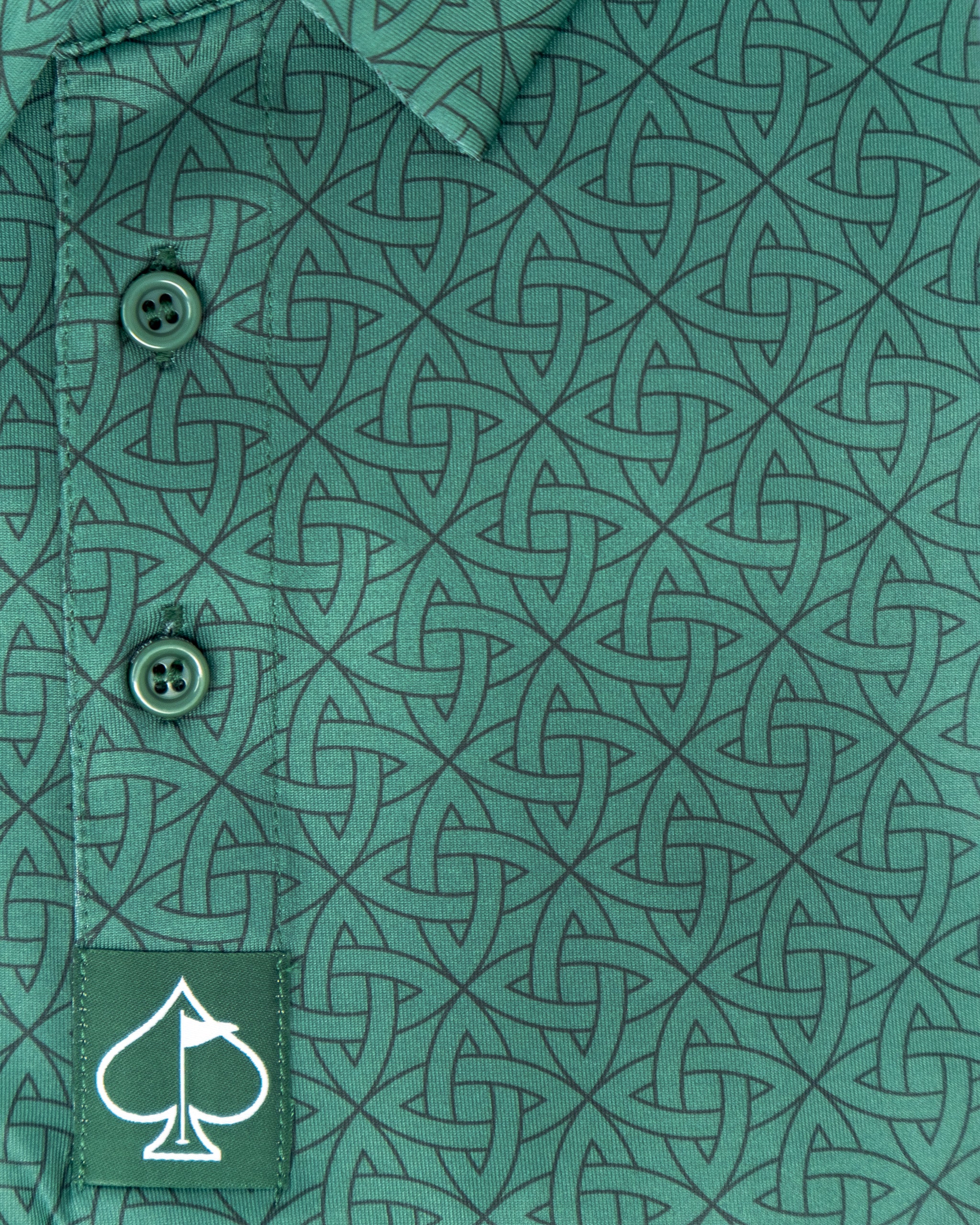 Emerald green polo shirt featuring a geometric pattern and a spade logo on the hem.