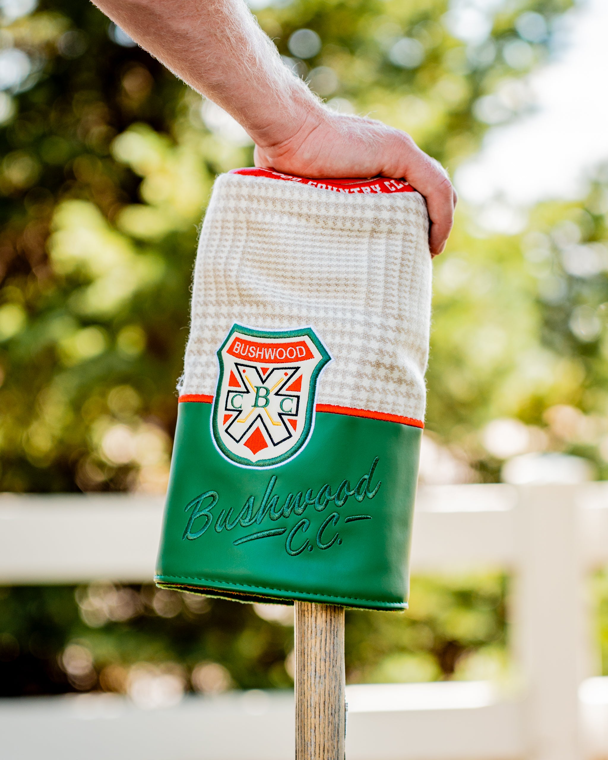 Bushwood CC driver cover featuring a textured white top and green base, showcasing the Bushwood logo for stylish protection.