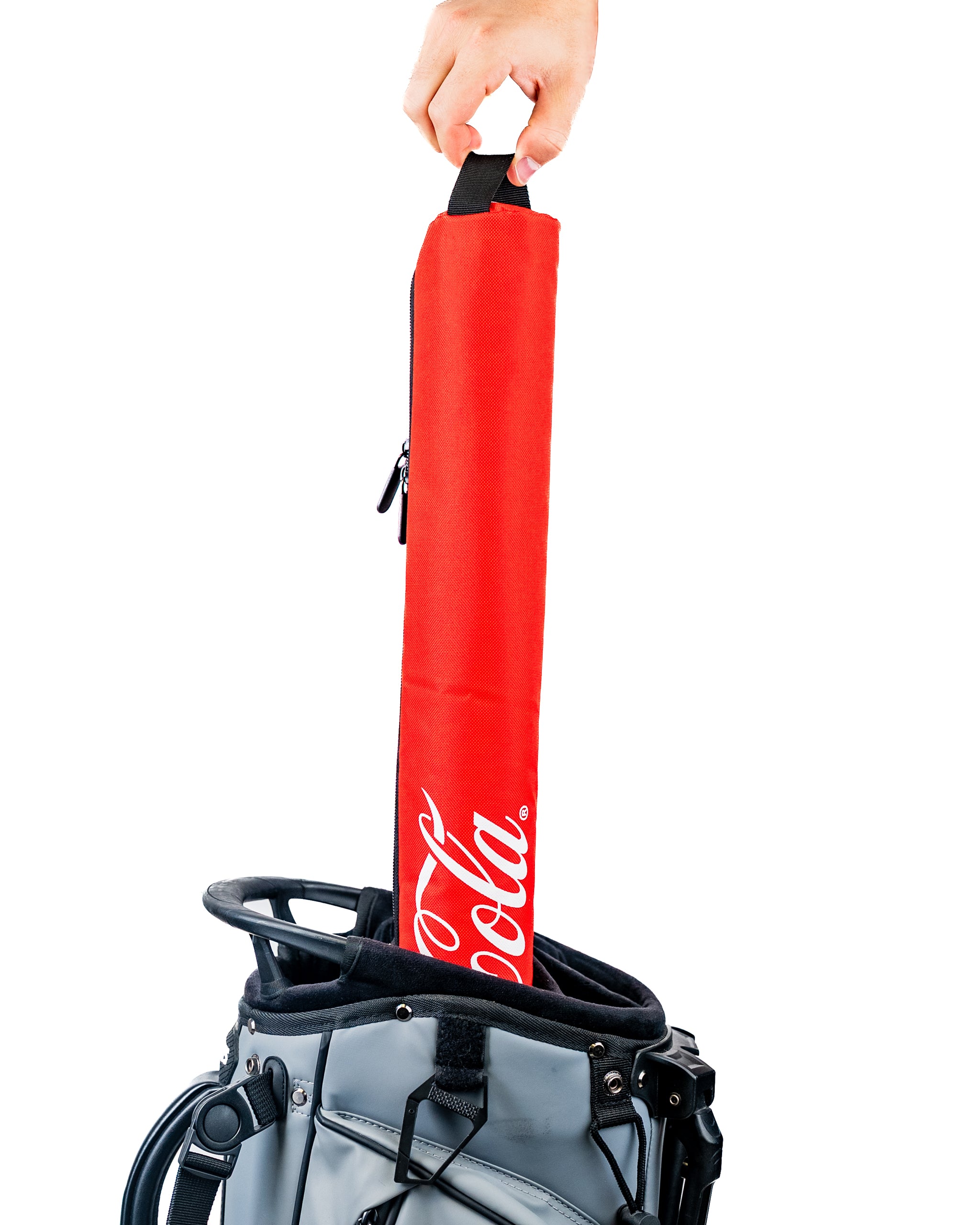 Coca-Cola sleeve being pulled from a golf bag, featuring a vibrant red design with the Coca-Cola logo.