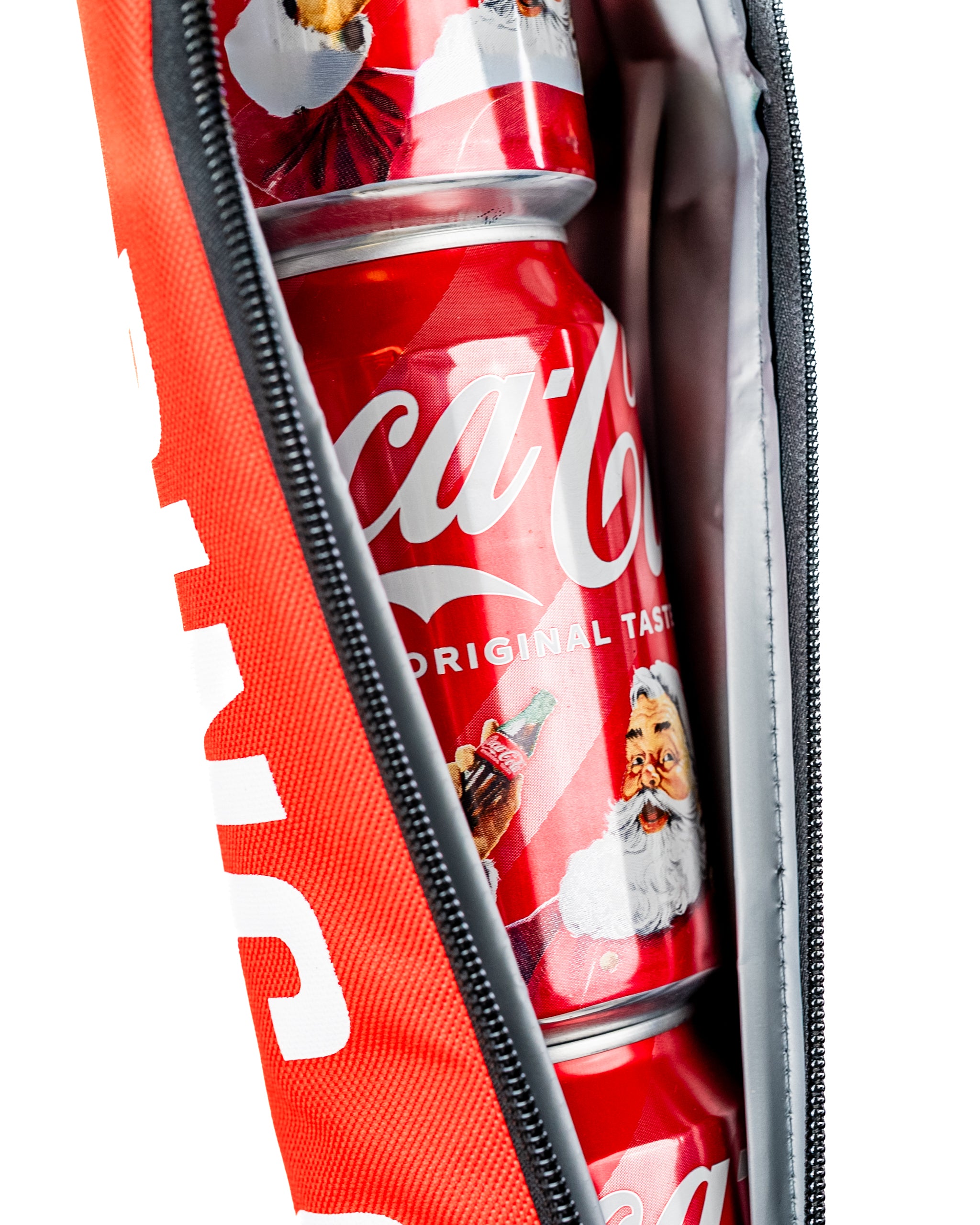 Coca-Cola sleeve featuring a vibrant design, holding multiple cans with festive Santa graphics inside.