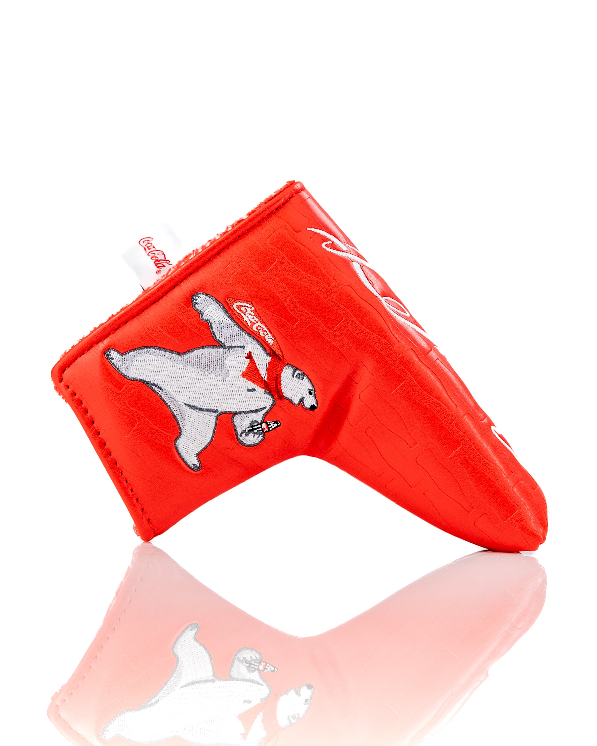 Coca-Cola Blade Putter Cover featuring a polar bear design in vibrant red, perfect for adding style on the golf course.