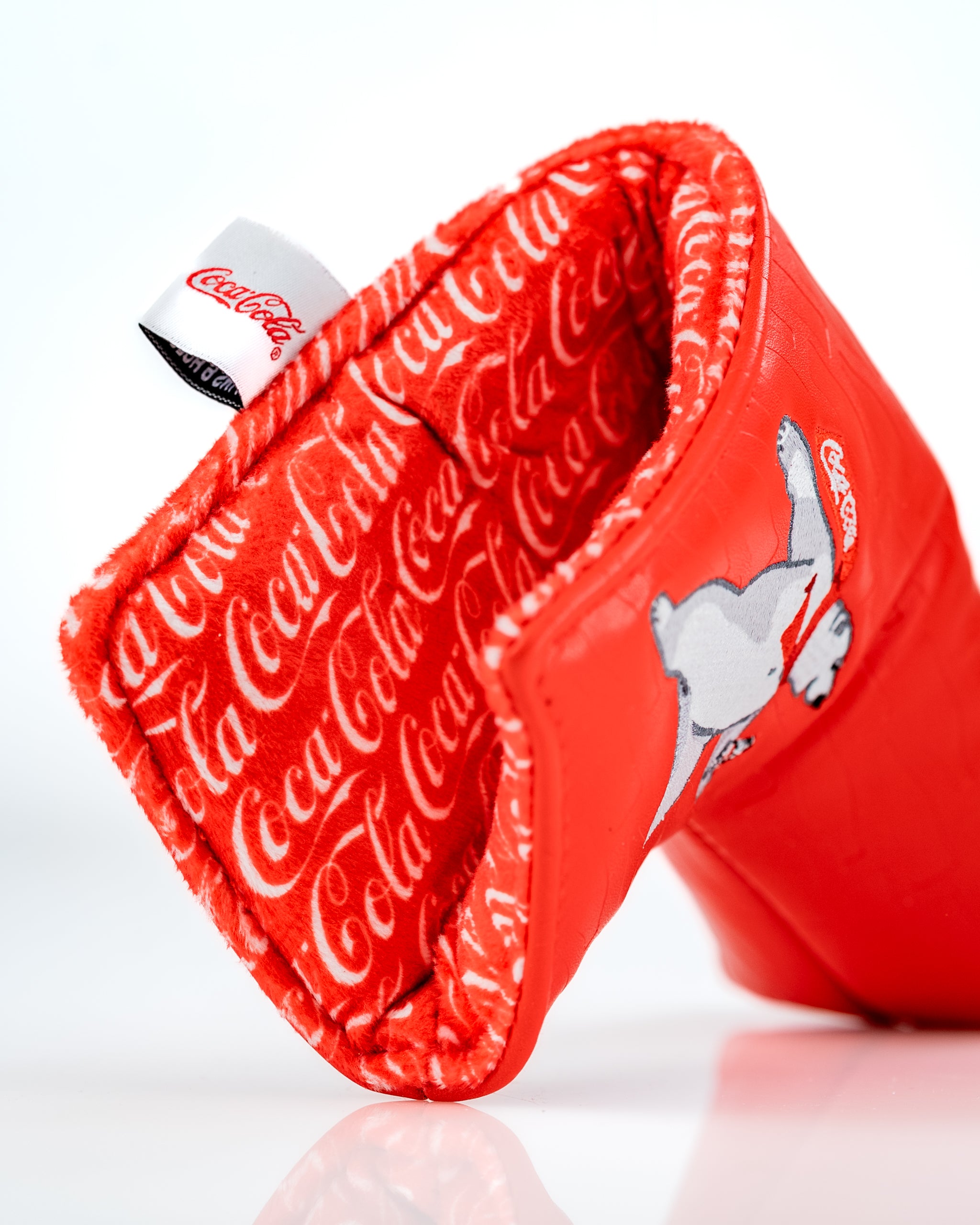 Coca-Cola Blade Putter Cover in vibrant red with a playful graphic, featuring soft lining for protection and style.