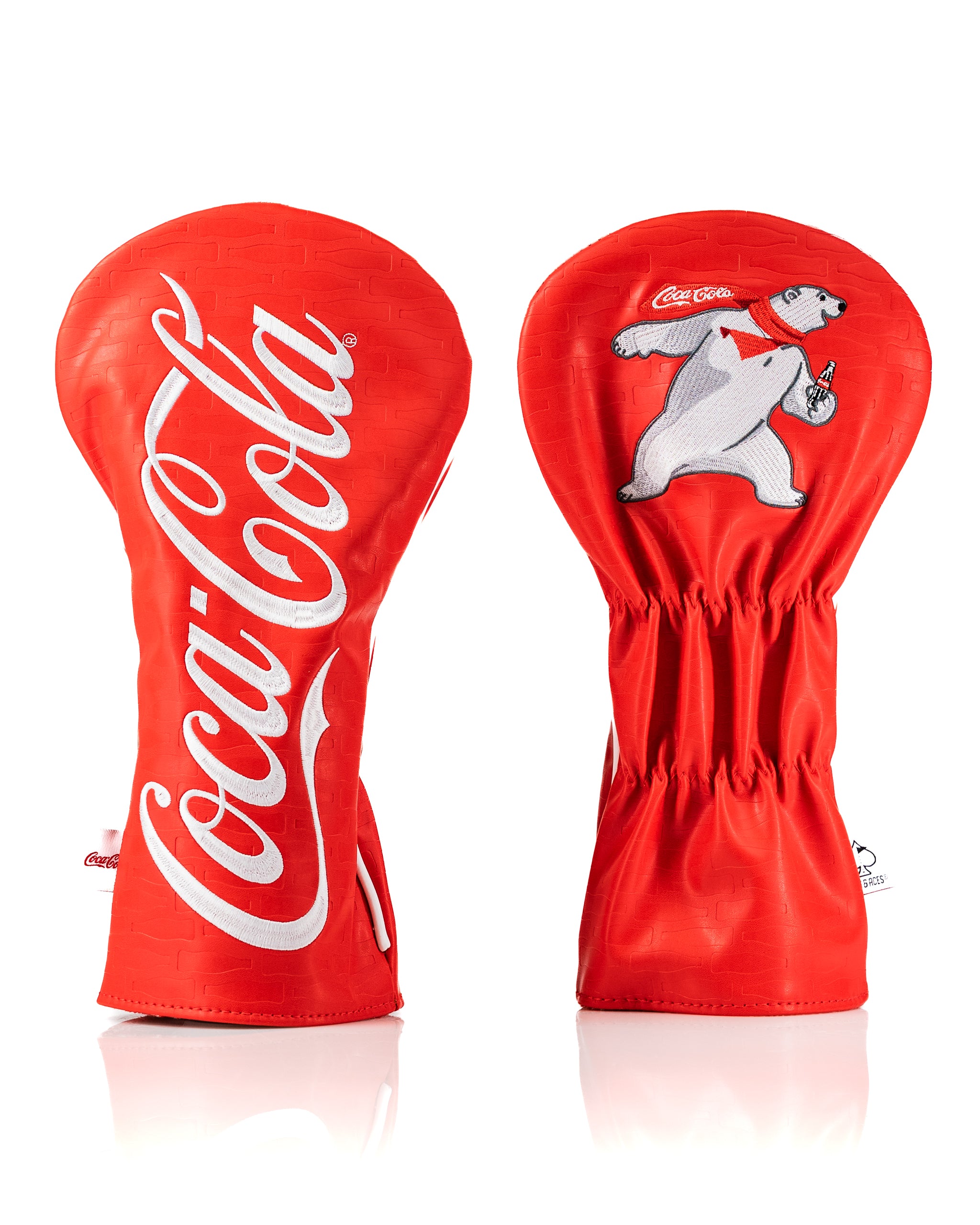Bold Coca-Cola driver cover featuring iconic red color, logo, and playful polar bear design for stylish golf accessories.