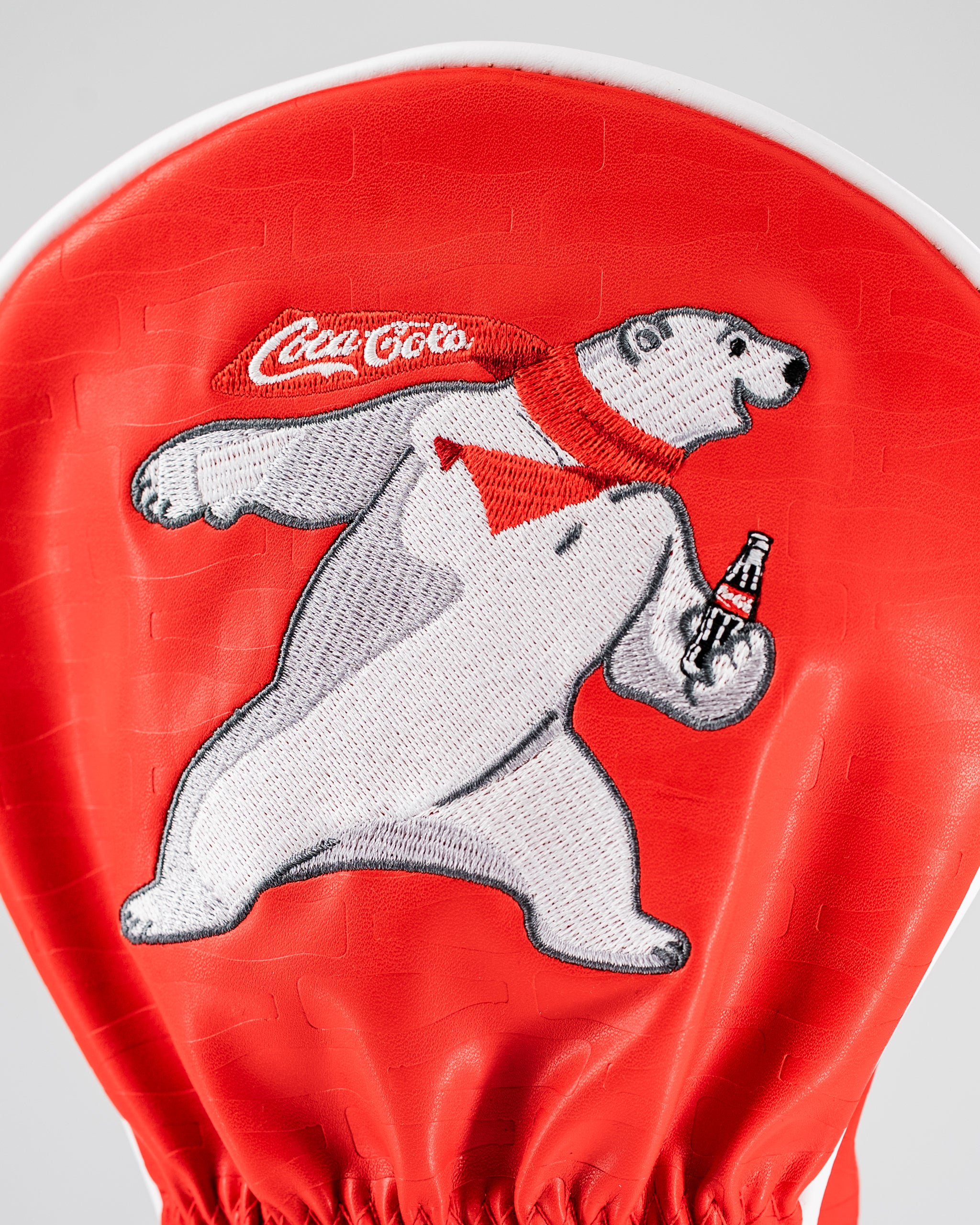Coca-Cola driver cover featuring a playful polar bear holding a Coke bottle, designed for stylish golf enthusiasts.