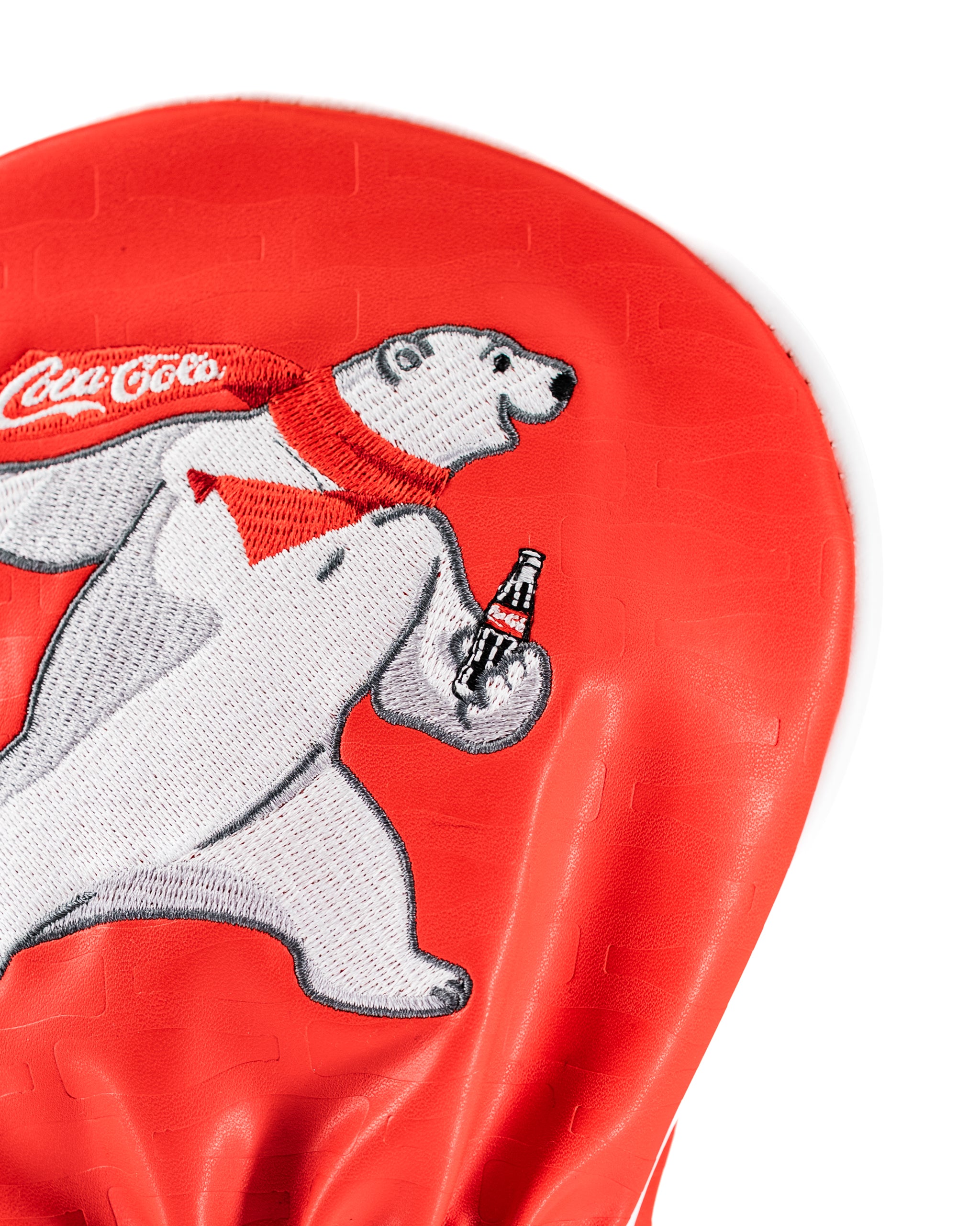 Coca-Cola driver cover featuring a playful polar bear holding a Coke bottle, designed for a bold golf style.