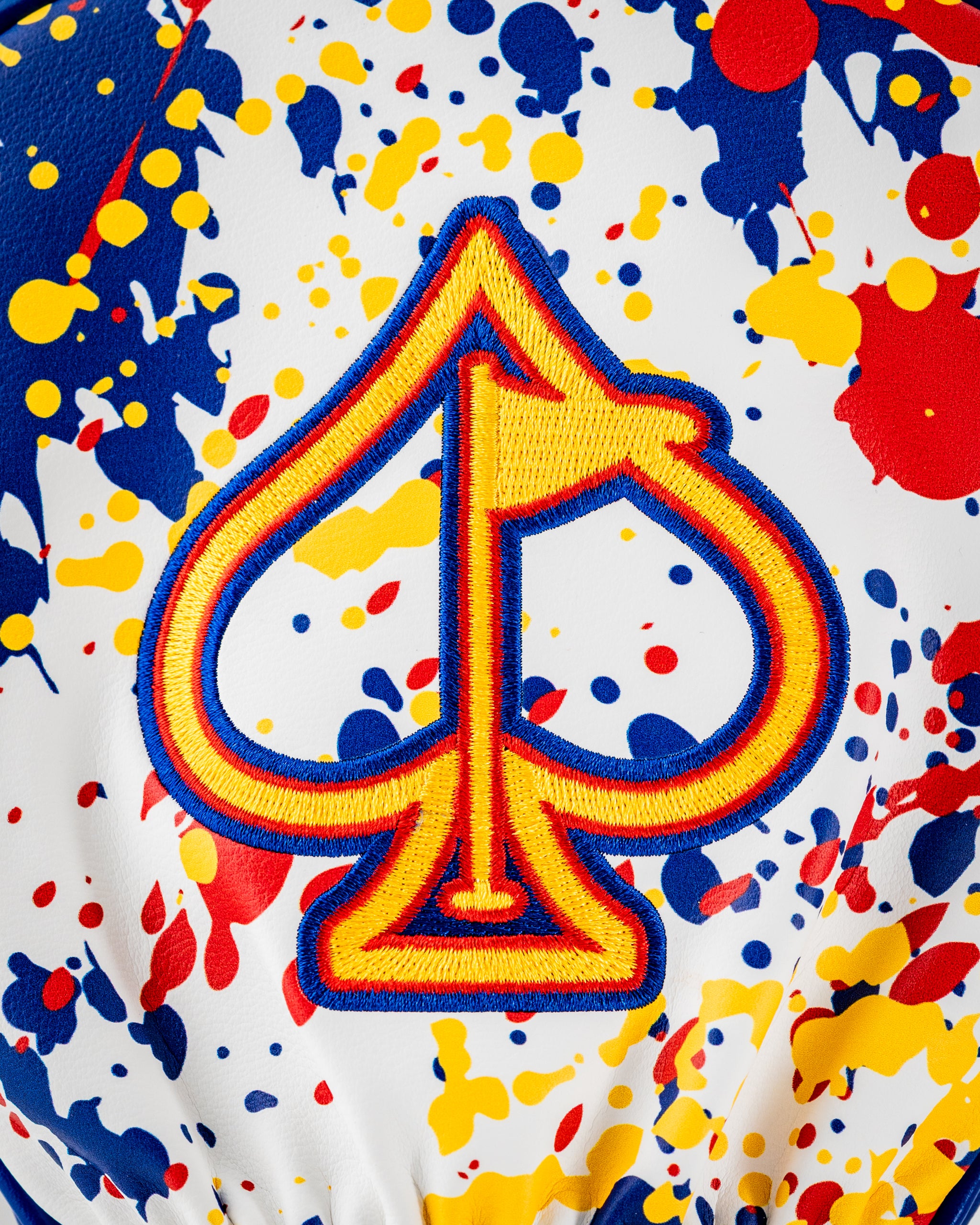 Colorful Colorado 2.0 headcover set featuring a bold spade logo with a splatter paint design in red, blue, and yellow.