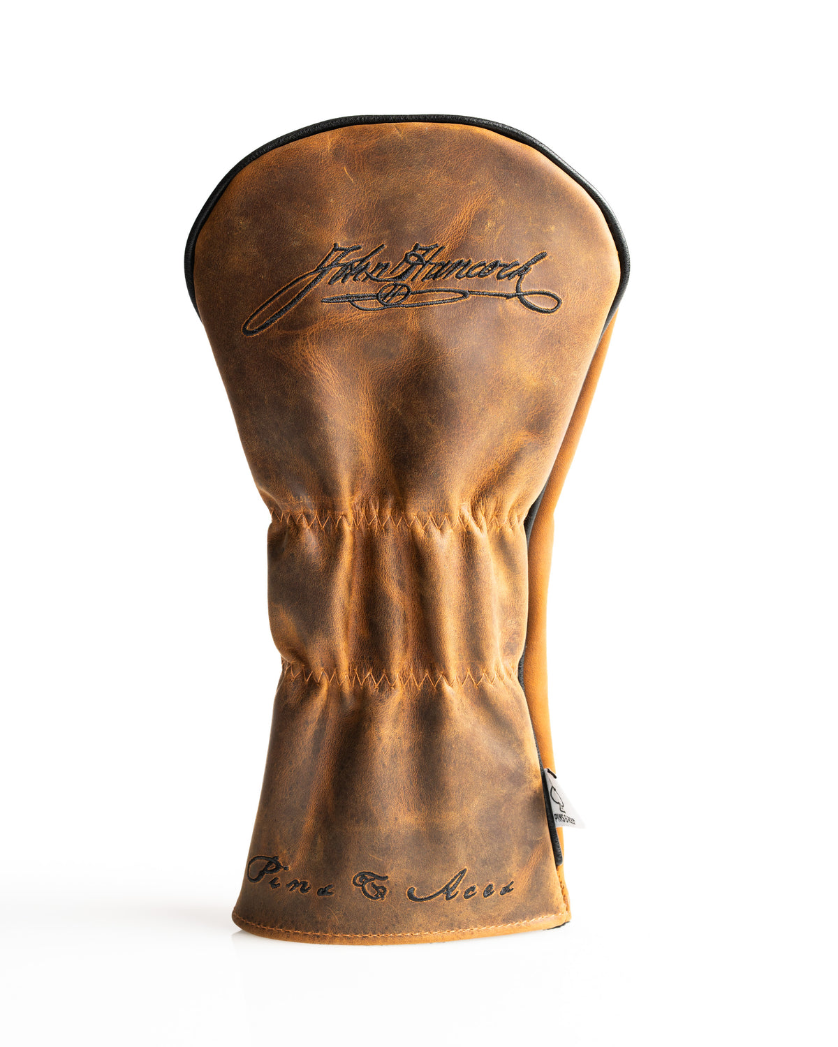 Stylish leather driver cover with a vintage finish and elegant script detailing, designed for golfers seeking unique accessories.