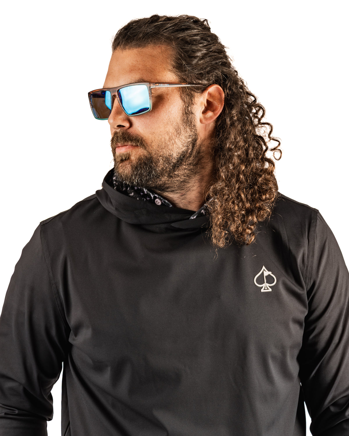 Man wearing a black performance golf hoodie with a duck hook design, paired with stylish sunglasses.