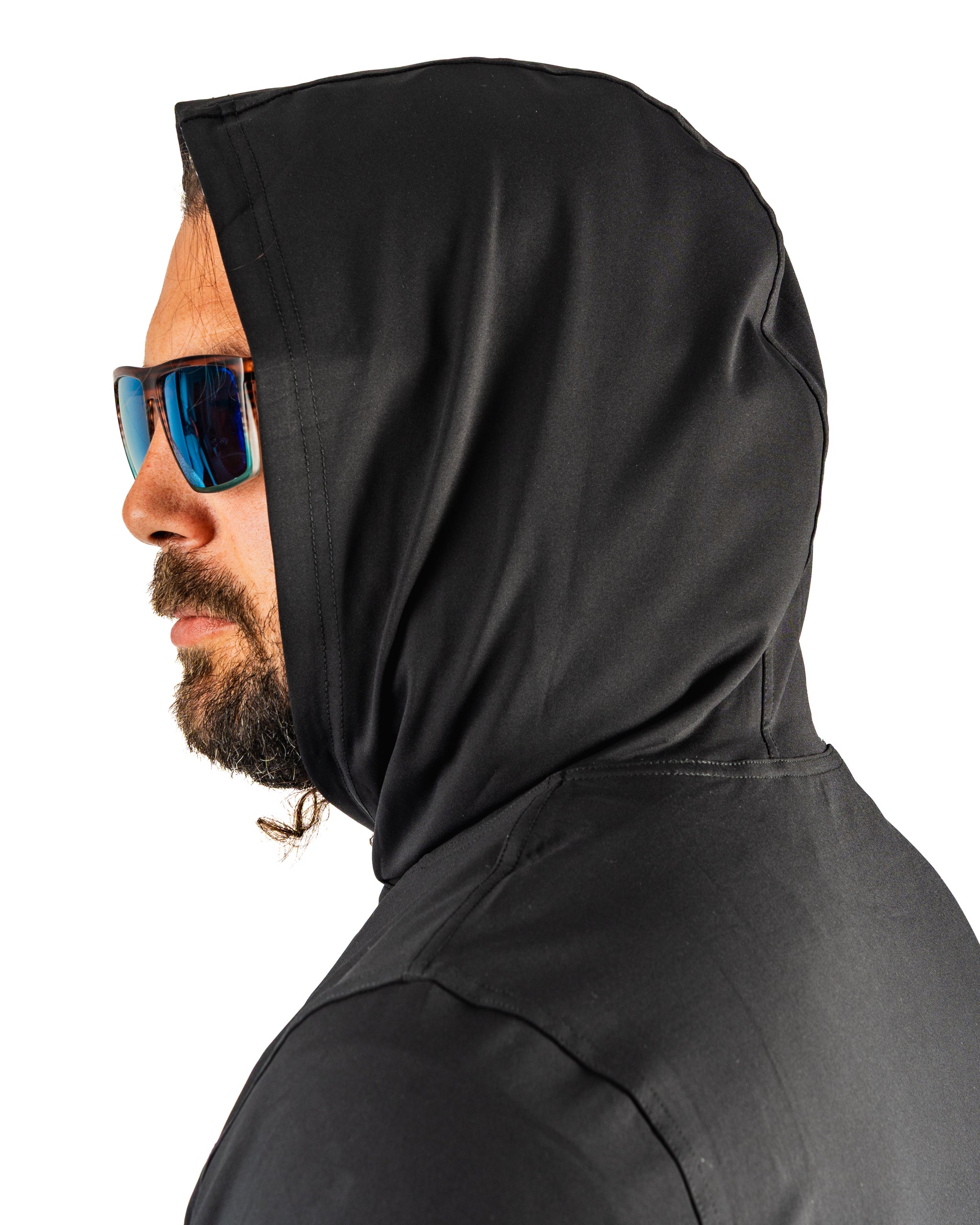 Performance golf hoodie in black with a hood, worn by a man with sunglasses, showcasing a stylish and functional design.
