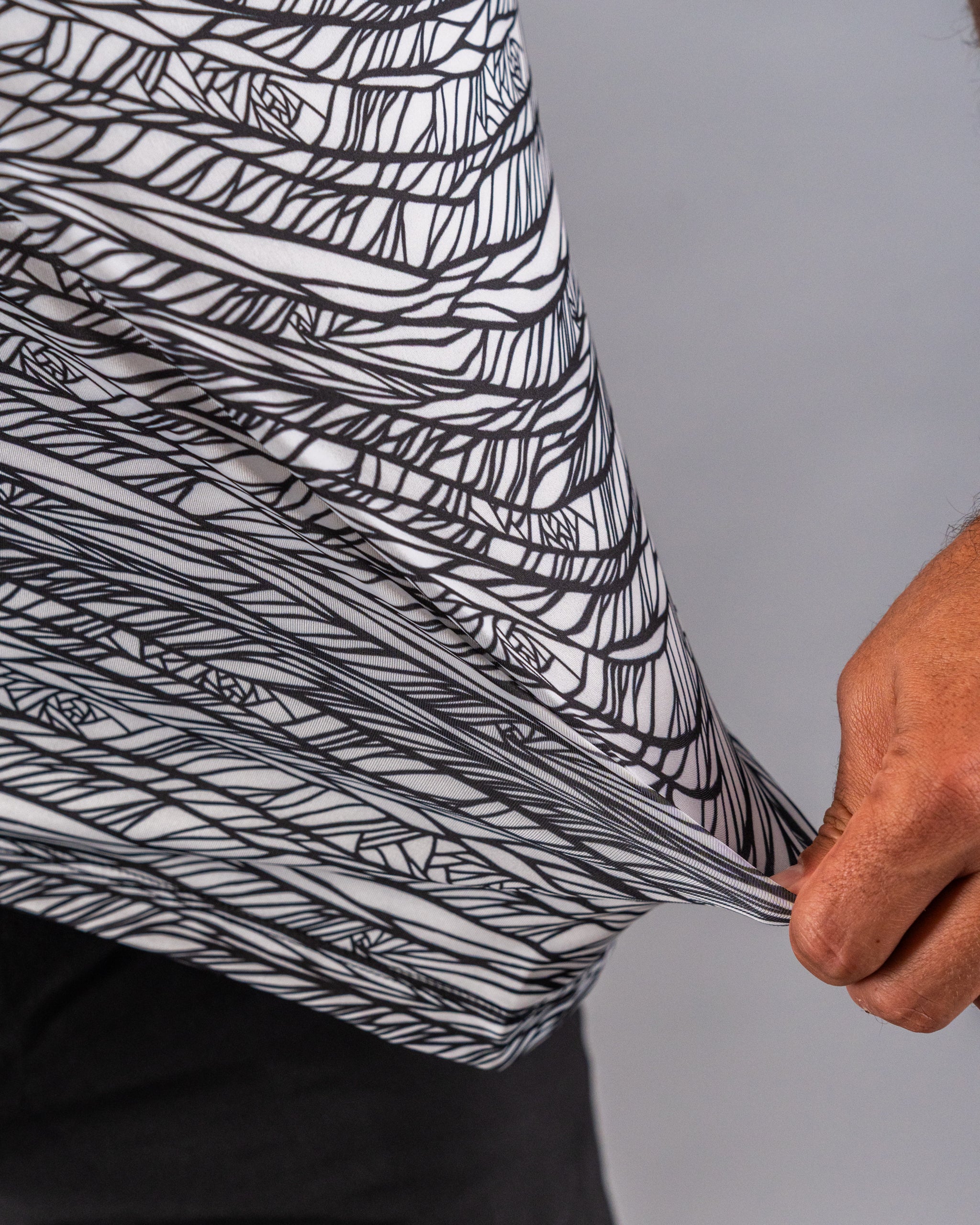 Bold black and white patterned golf shirt showcasing a unique geometric design, perfect for stylish golfers.
