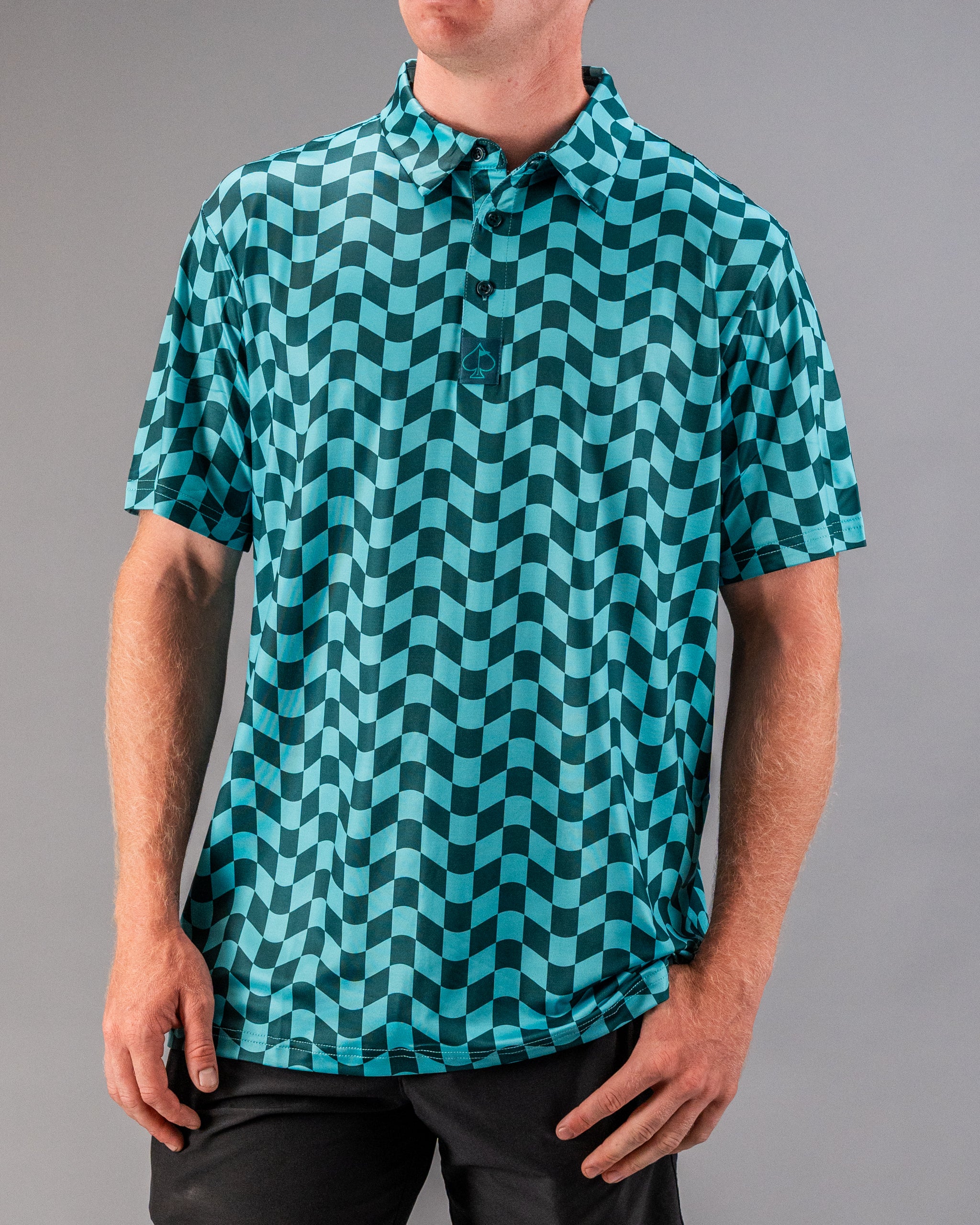 Bold teal and black checkered golf polo shirt featuring a modern wavy pattern, perfect for stylish golfers.