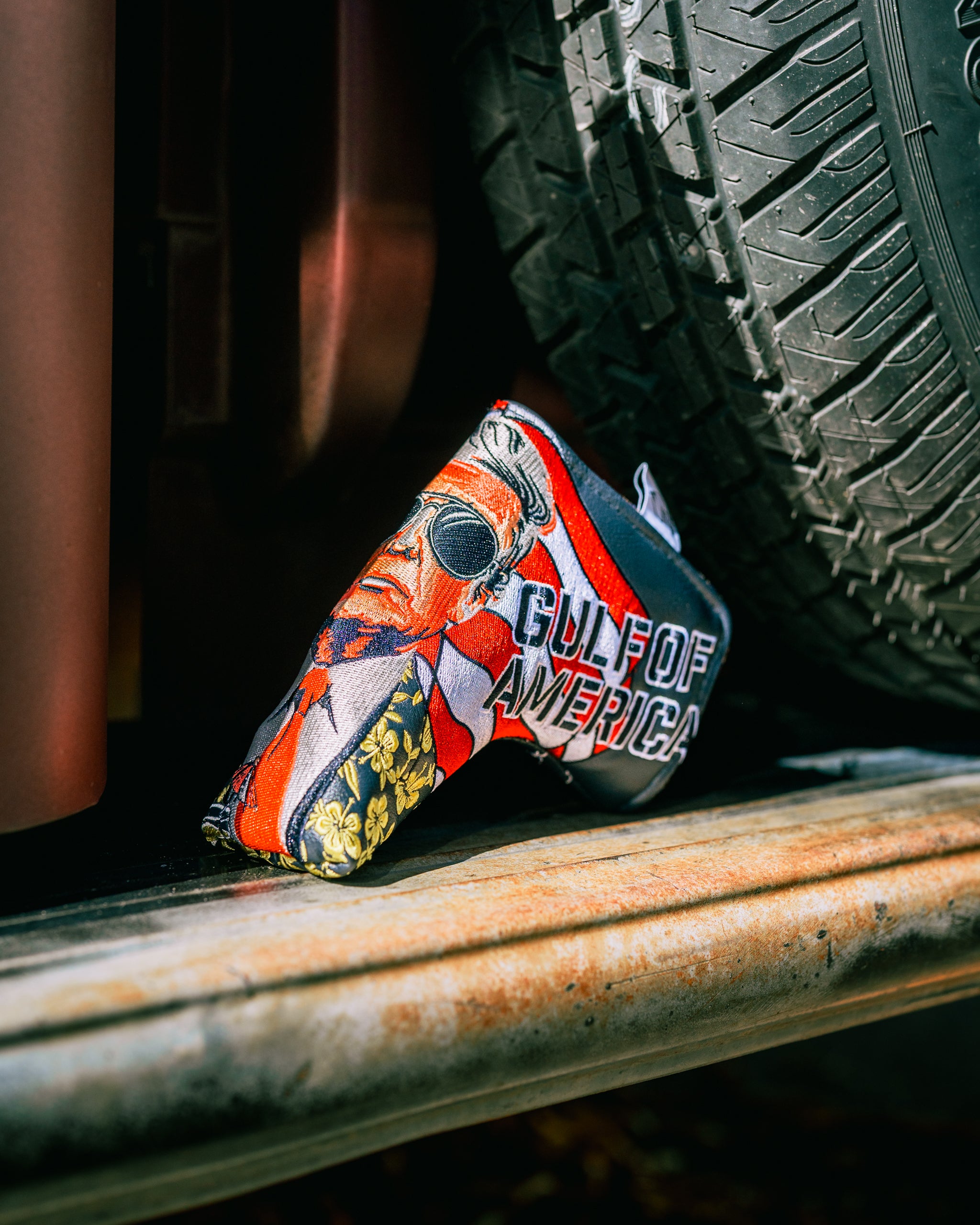 Bold golf blade cover featuring a patriotic design with "Gulf of America" text and a stylized character illustration.