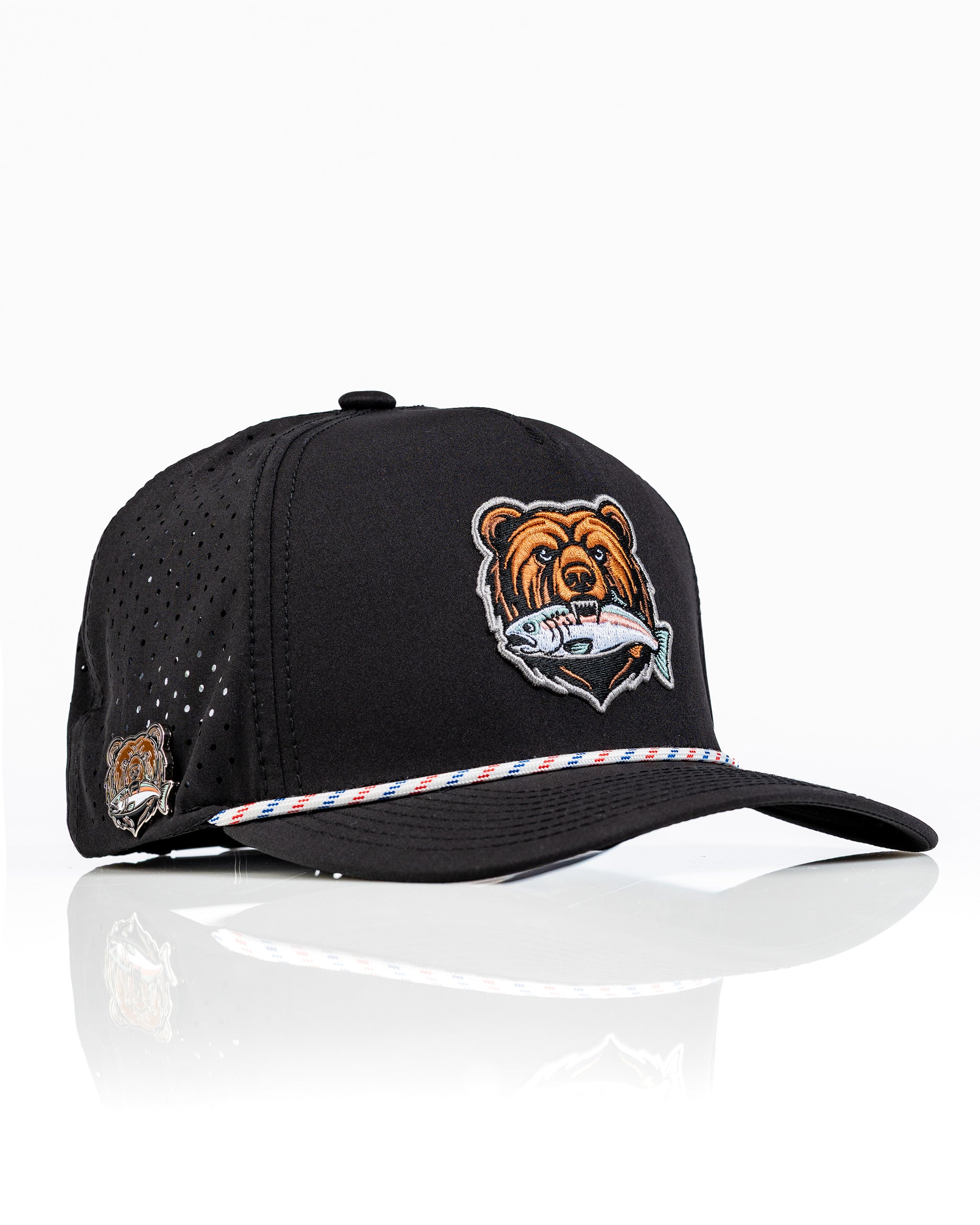 Perforated black rope hat featuring a Grizzly bear logo and a colorful striped band, ideal for stylish golfers.