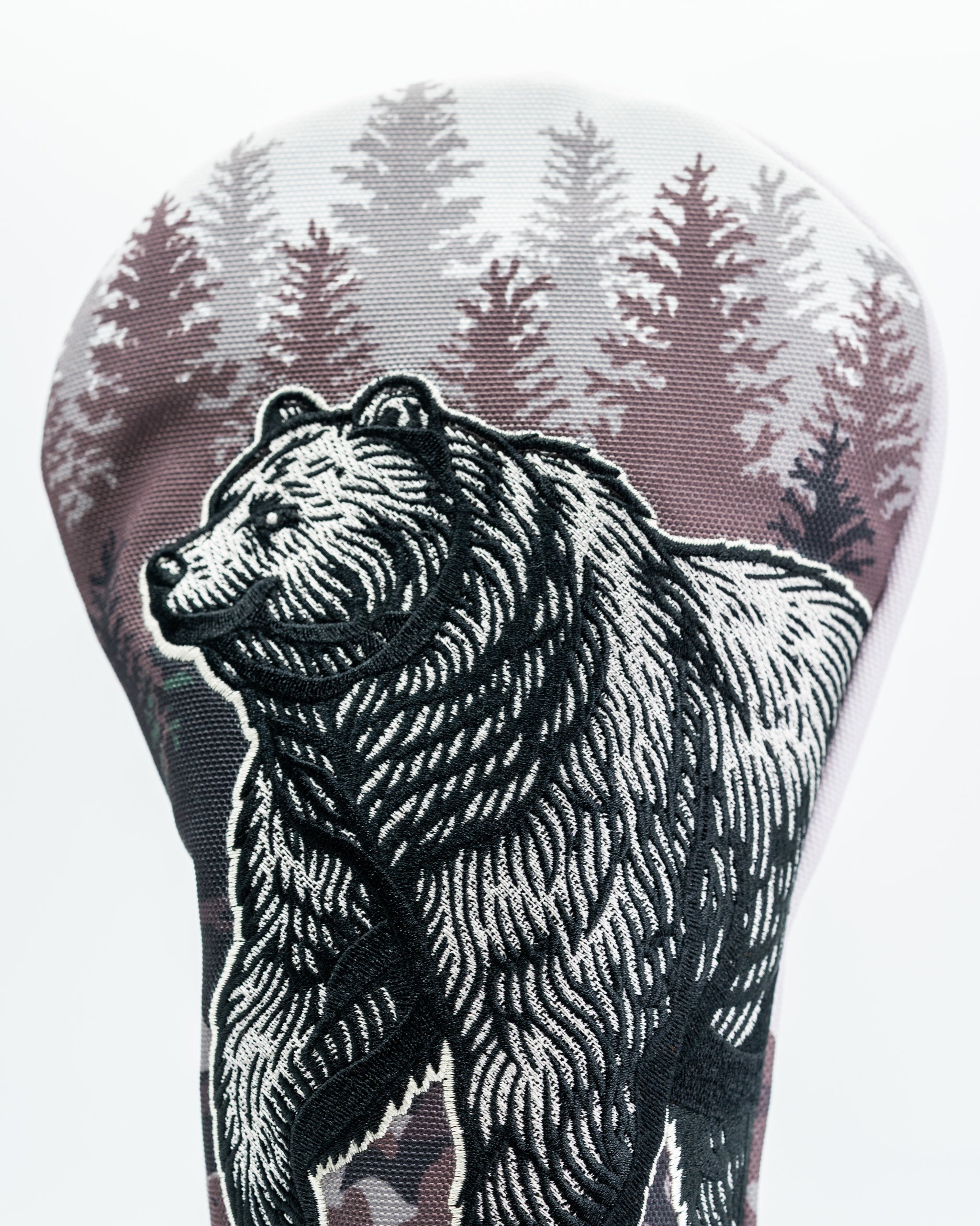 Bold driver cover featuring a detailed bear design against a forest backdrop, perfect for golfers seeking unique style.