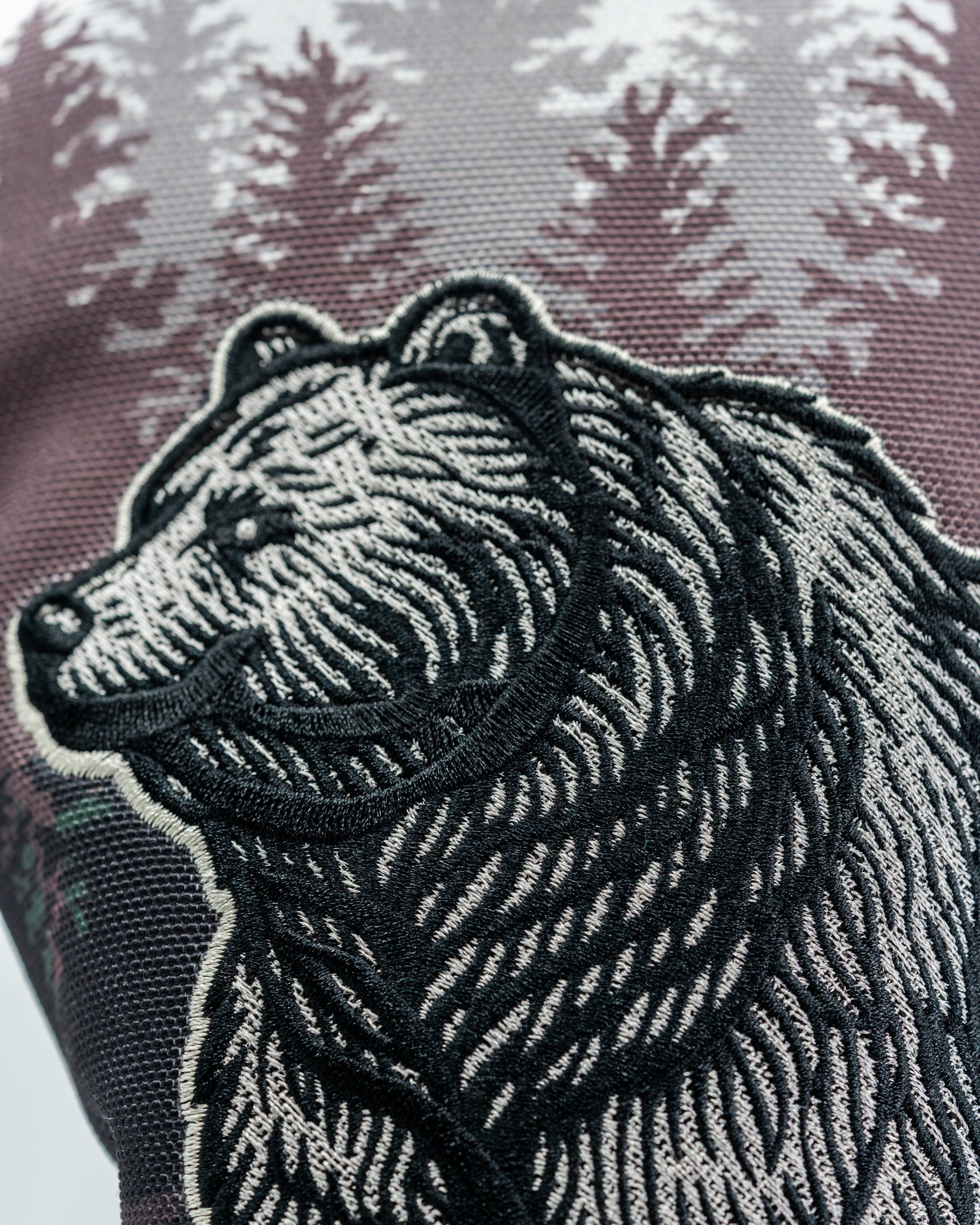 Bold driver cover featuring a detailed bear design against a forest backdrop, perfect for golfers who want to stand out.