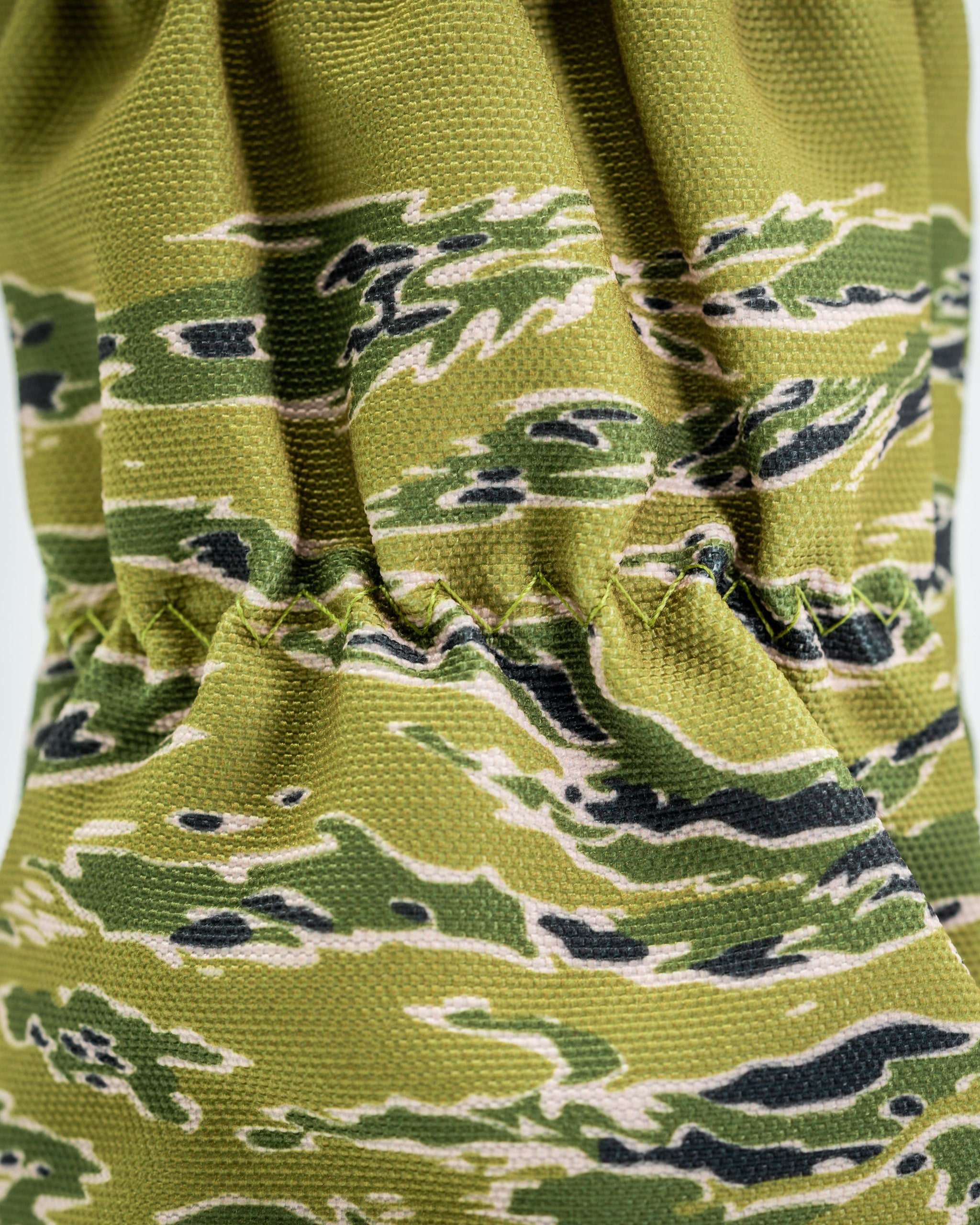 Camouflage-patterned driver cover featuring a snug fit design, perfect for golfers looking to stand out on the course.