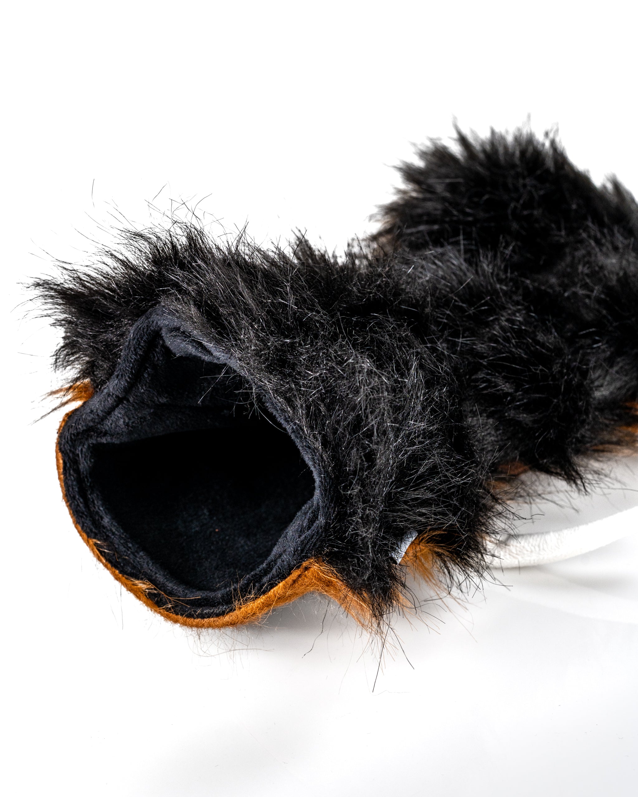 Woolly Mammoth driver cover featuring soft black and brown faux fur for a bold, unique golf accessory.
