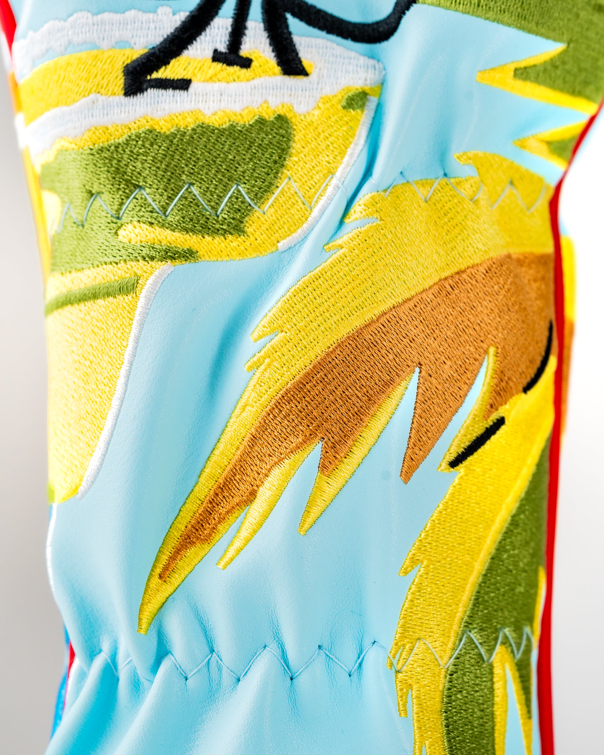 Vibrant Margaritaville x Pins & Aces headcover set featuring tropical designs and bright colors, perfect for golf enthusiasts.