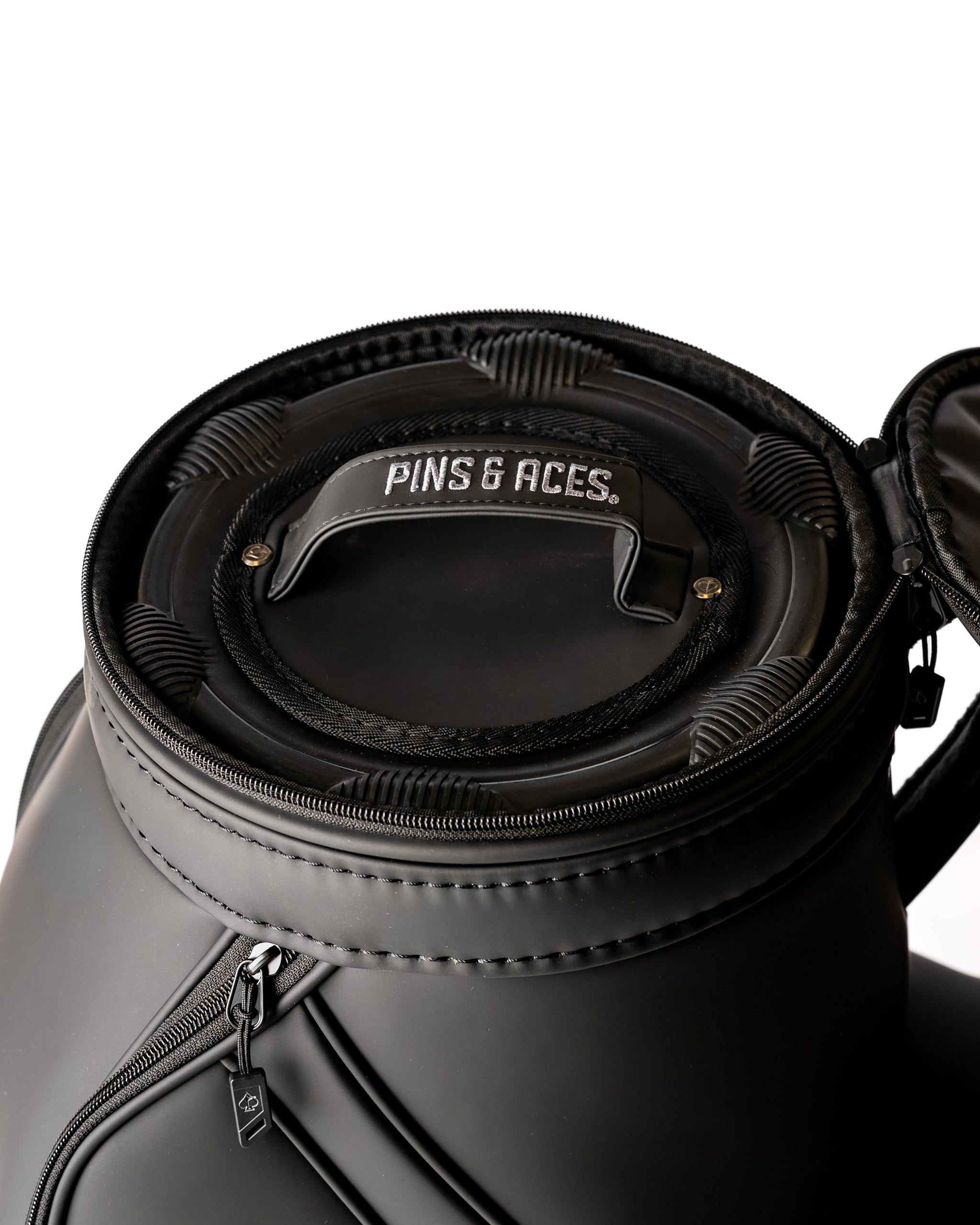 Close-up of the Den Caddy in Obsidian, featuring a sleek design and branded handle for easy transport.