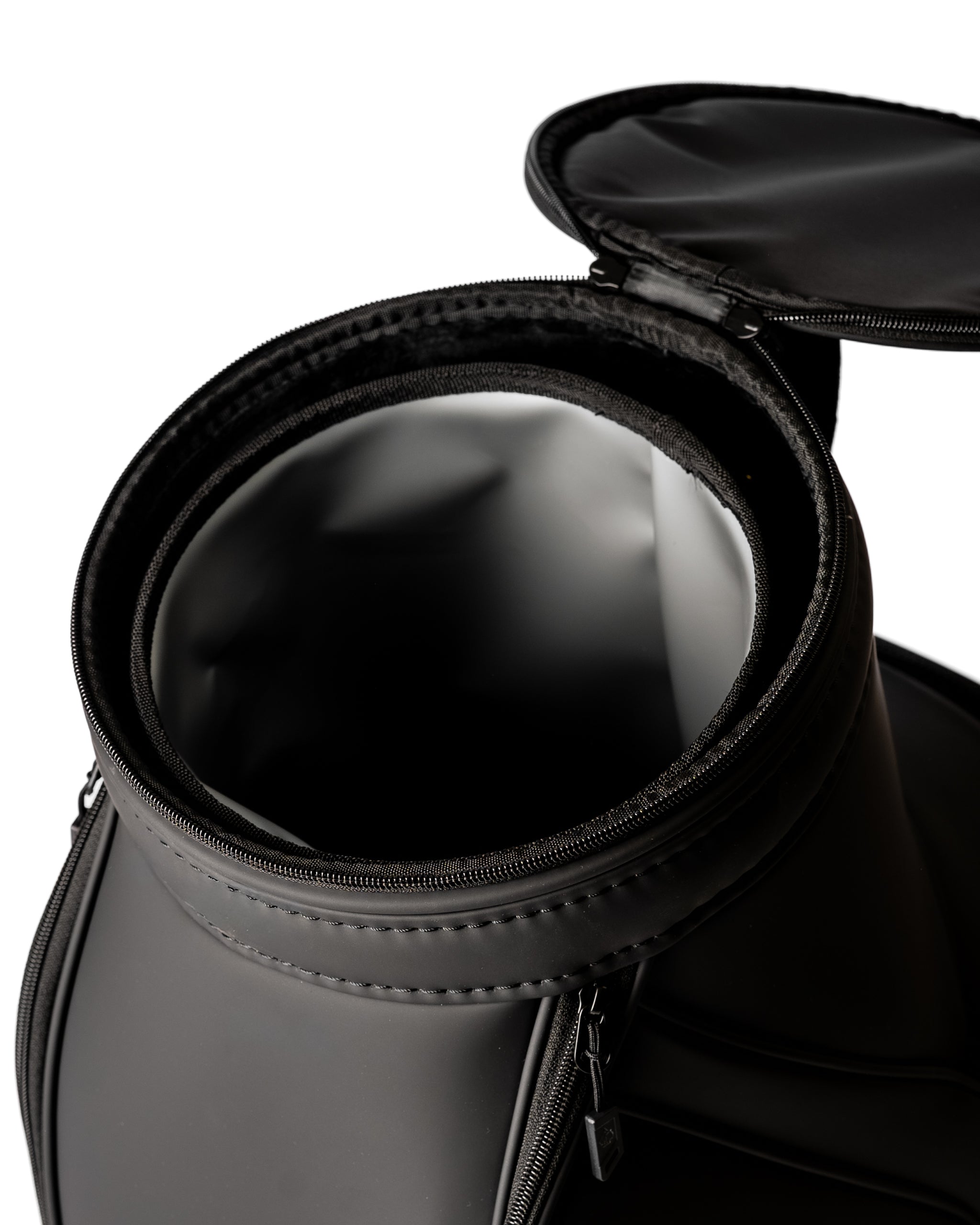 Sleek obsidian golf den caddy with a zippered top, showcasing a spacious, smooth interior for easy access and storage.