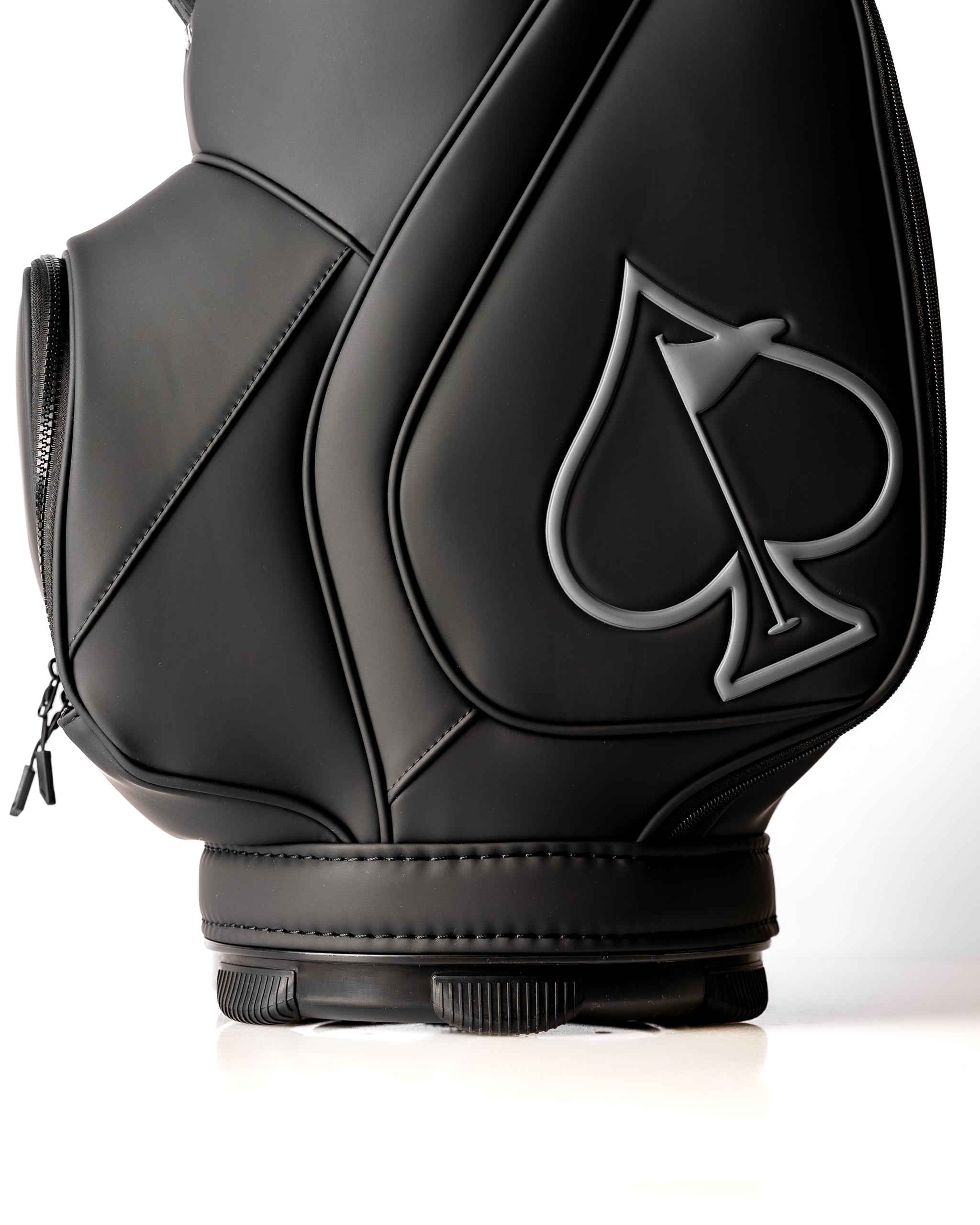 Sleek black golf den caddy with a prominent spade logo, designed for stylish storage on the course.