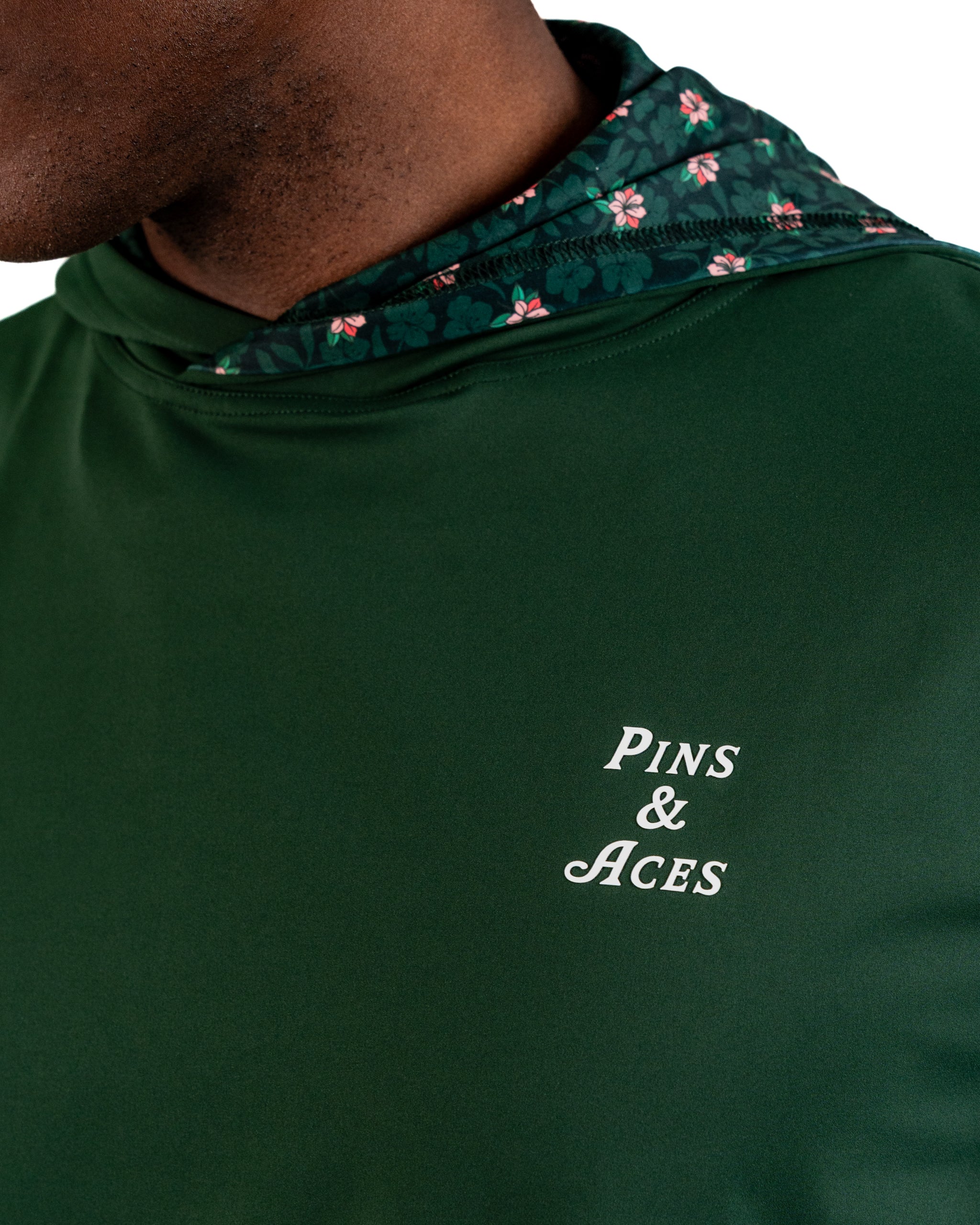 Performance Golf Hoodie in Dark Azalea features a floral-lined hood and a stylish logo, perfect for bold golfers.