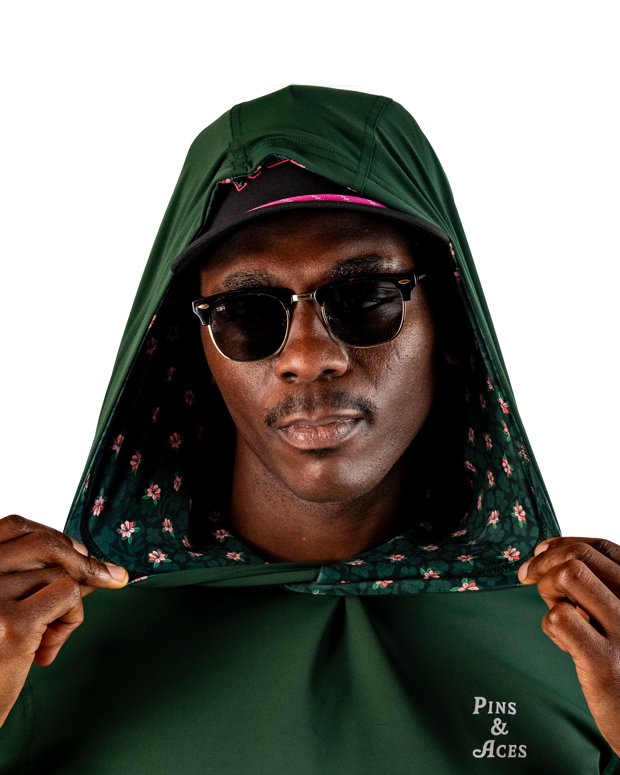 Performance Golf Hoodie in Dark Azalea, featuring a floral-lined hood and stylish sunglasses, perfect for golfers.