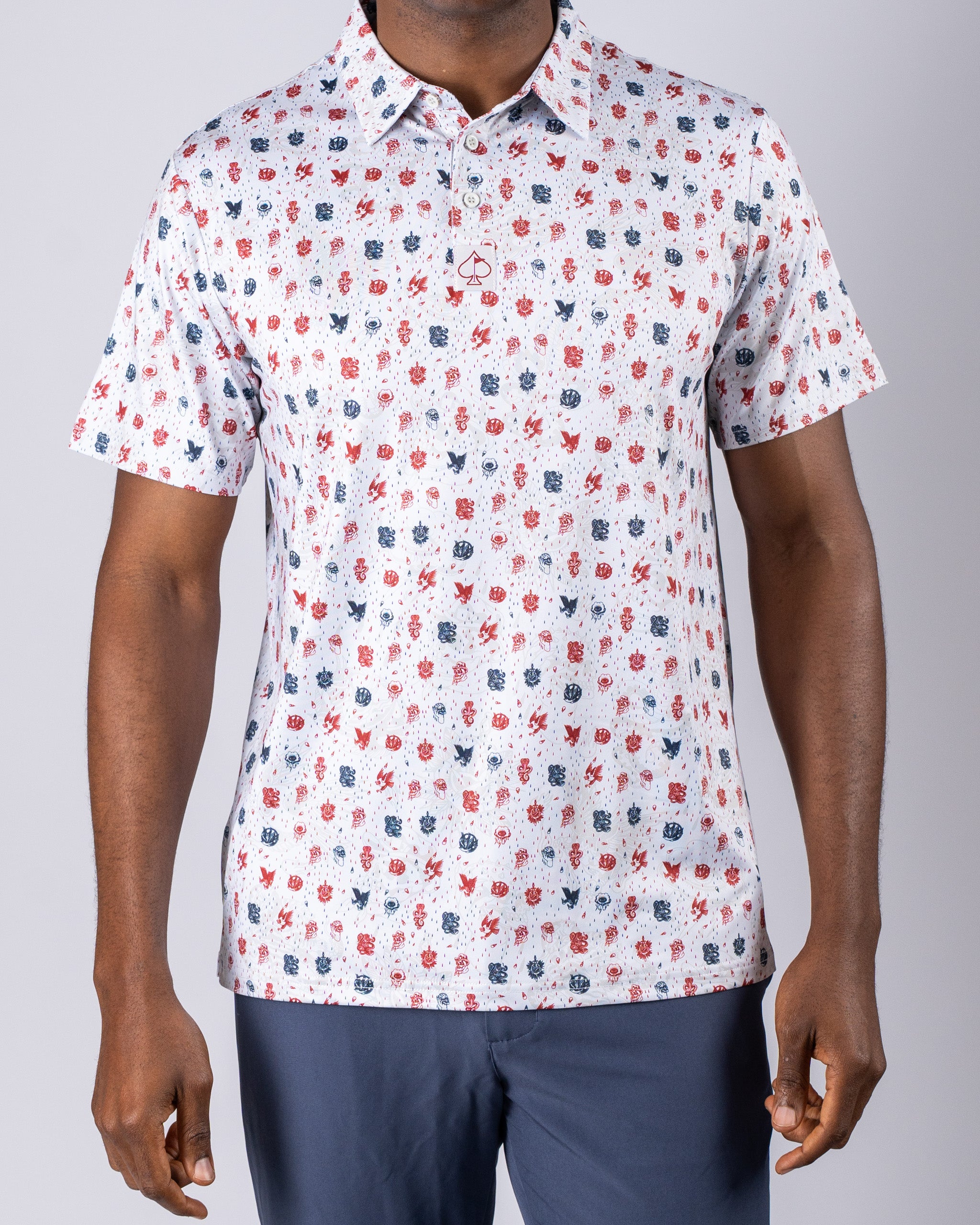 Men's American Traditional golf shirt featuring a vibrant pattern of red, white, and blue designs, perfect for stylish play.