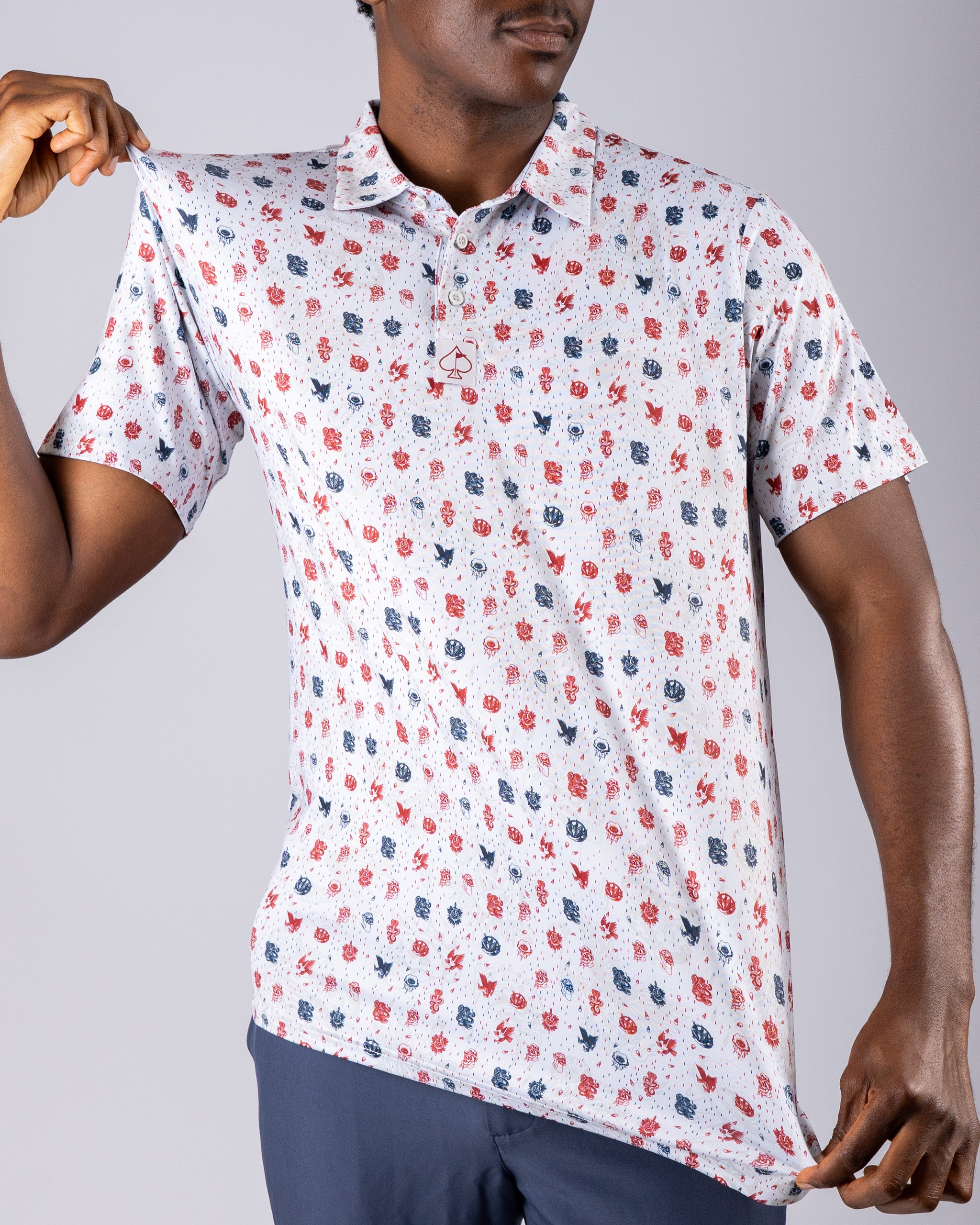 Men's golf polo shirt featuring an American traditional print with red, white, and blue designs for a bold look on the course.