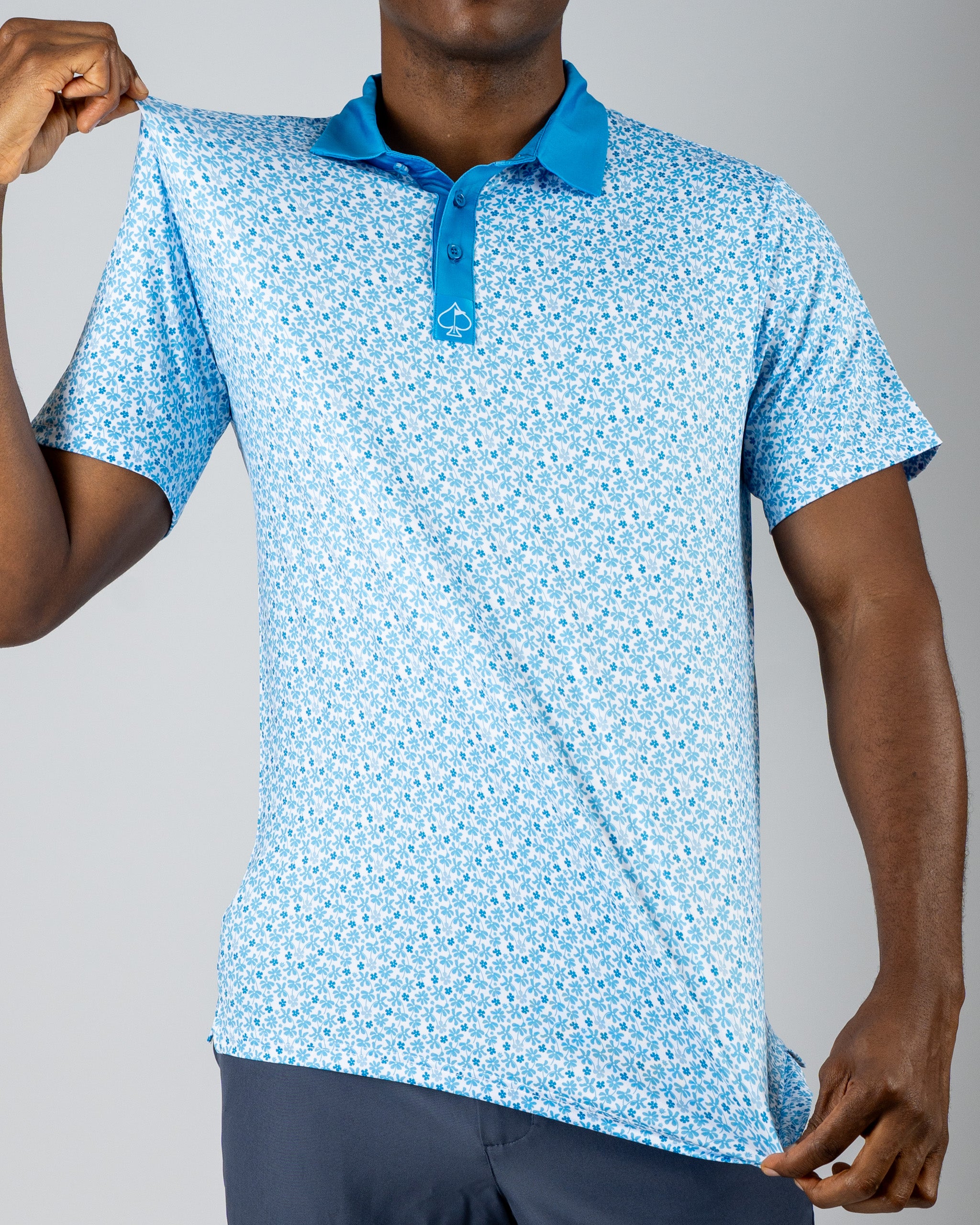 Men's blue floral golf polo shirt featuring a stylish collar, perfect for a bold look on the course.