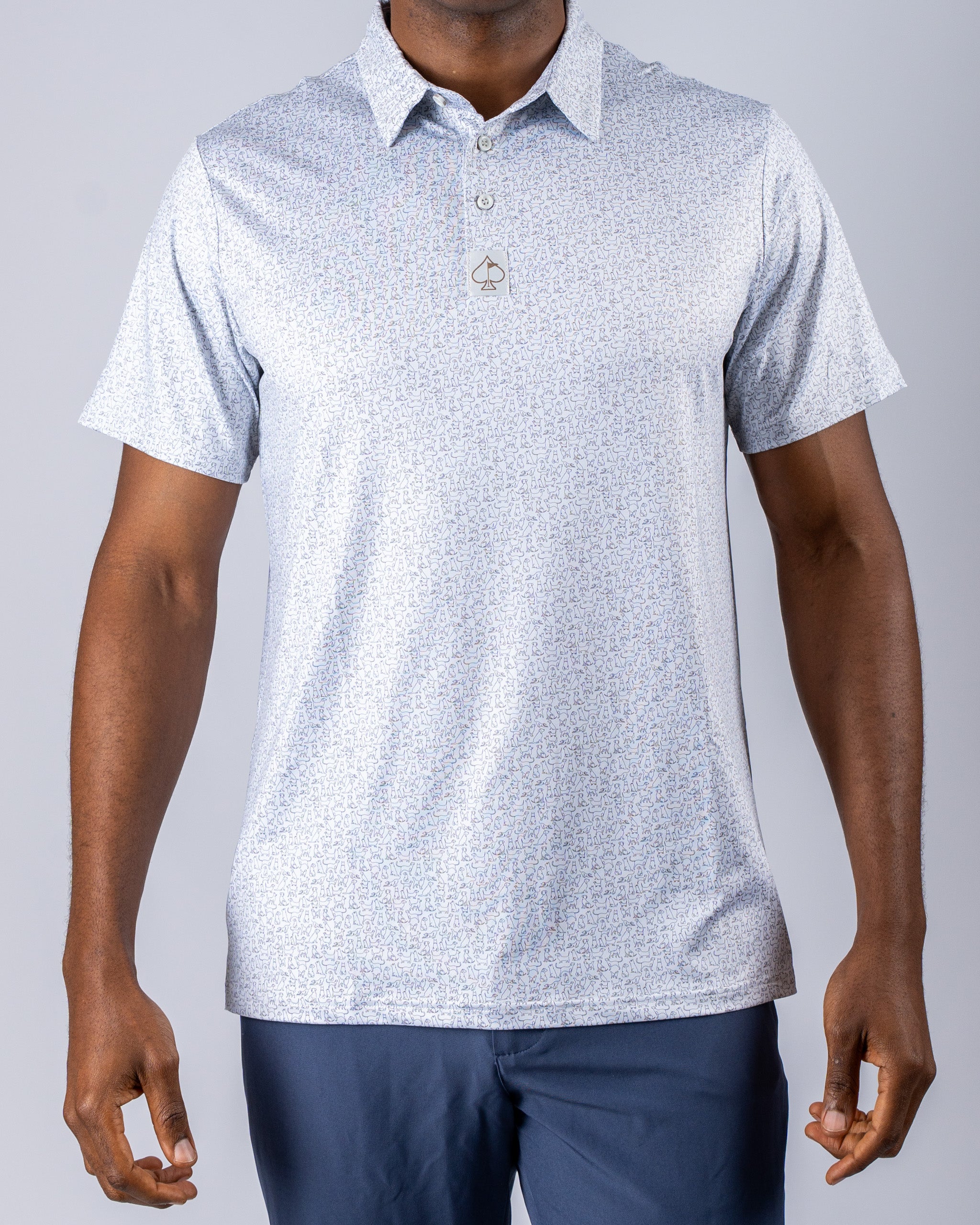 Men's golf polo featuring a light, playful dog print on a soft fabric, perfect for stylish performance on the course.
