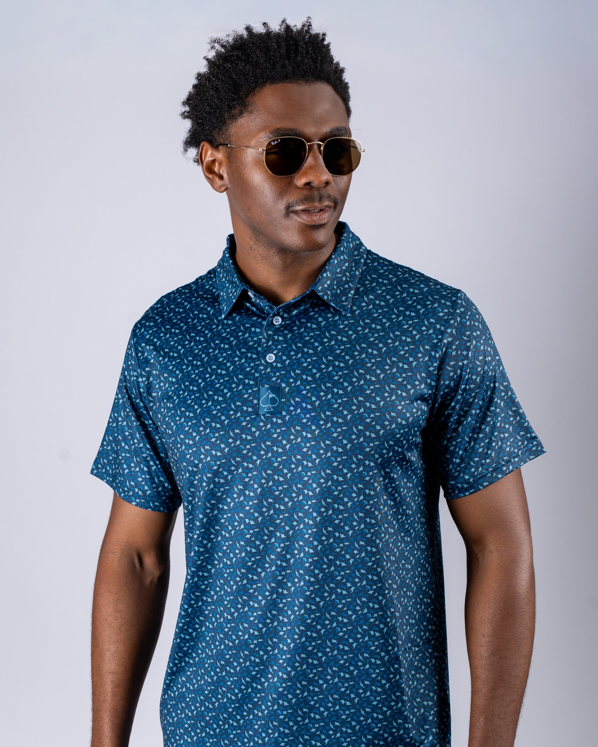 Men's Manta Ray golf polo in navy with a unique pattern, perfect for stylish performance on the course.