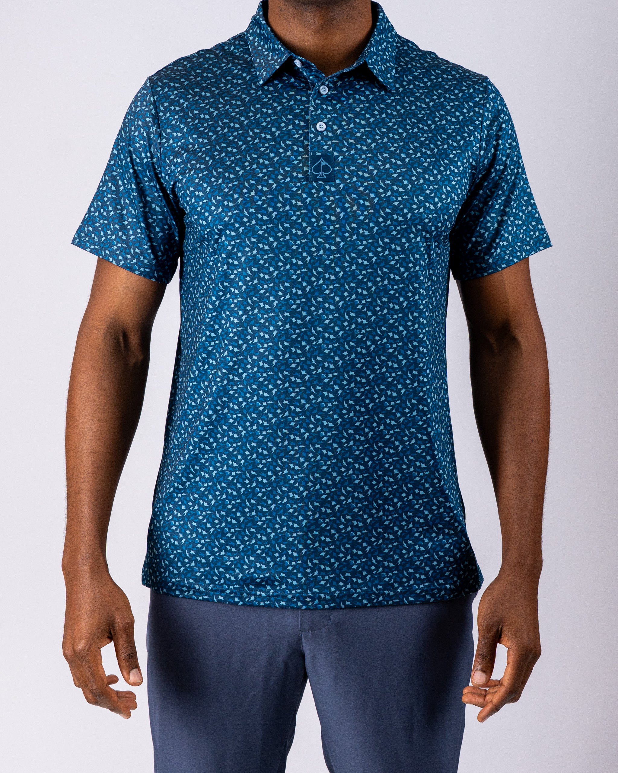 Men's Manta Ray golf polo in teal with a unique pattern, designed for comfort and style on the course.