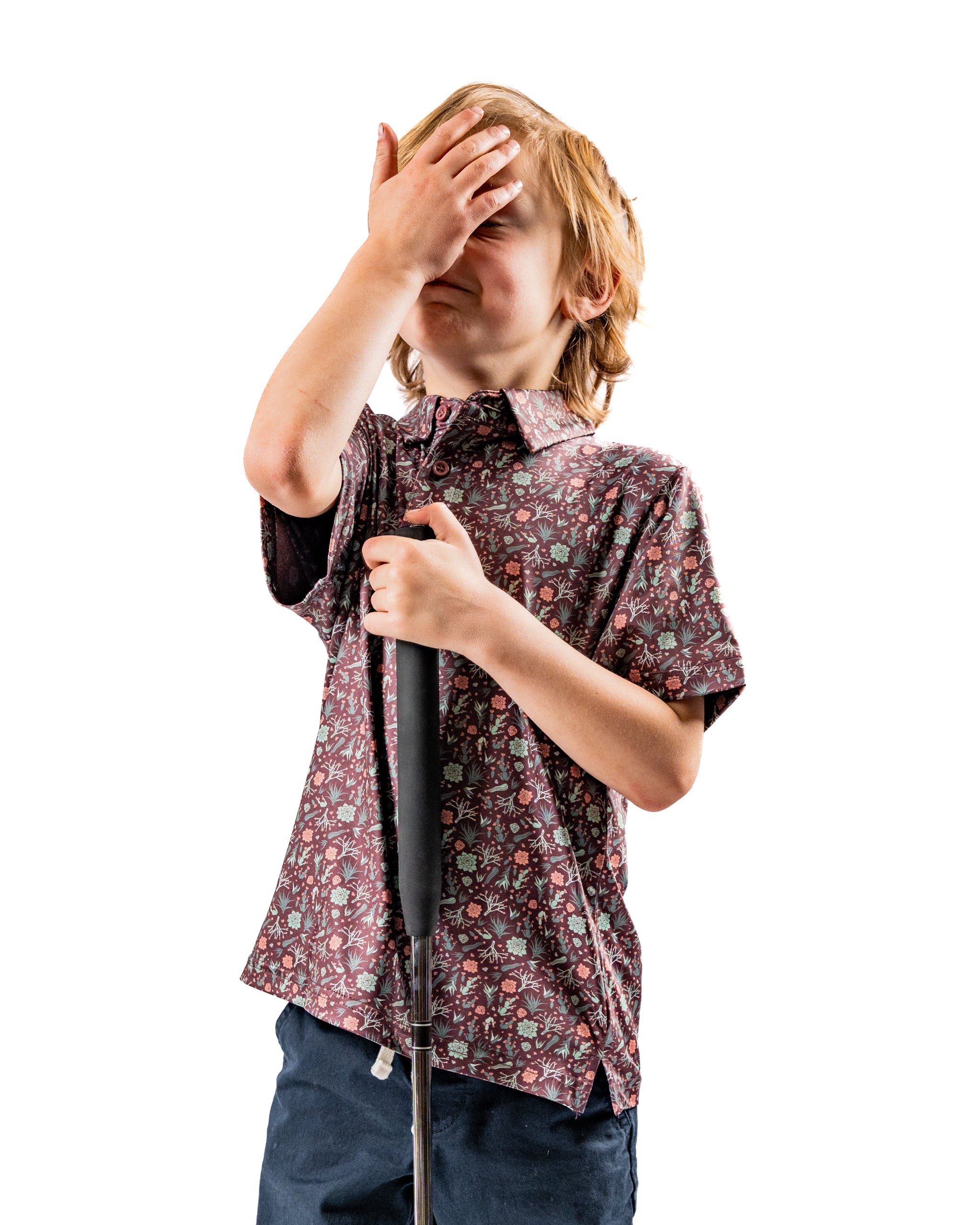 Youth Desert Sage golf shirt featuring a playful floral pattern, perfect for young golfers wanting to stand out on the course.