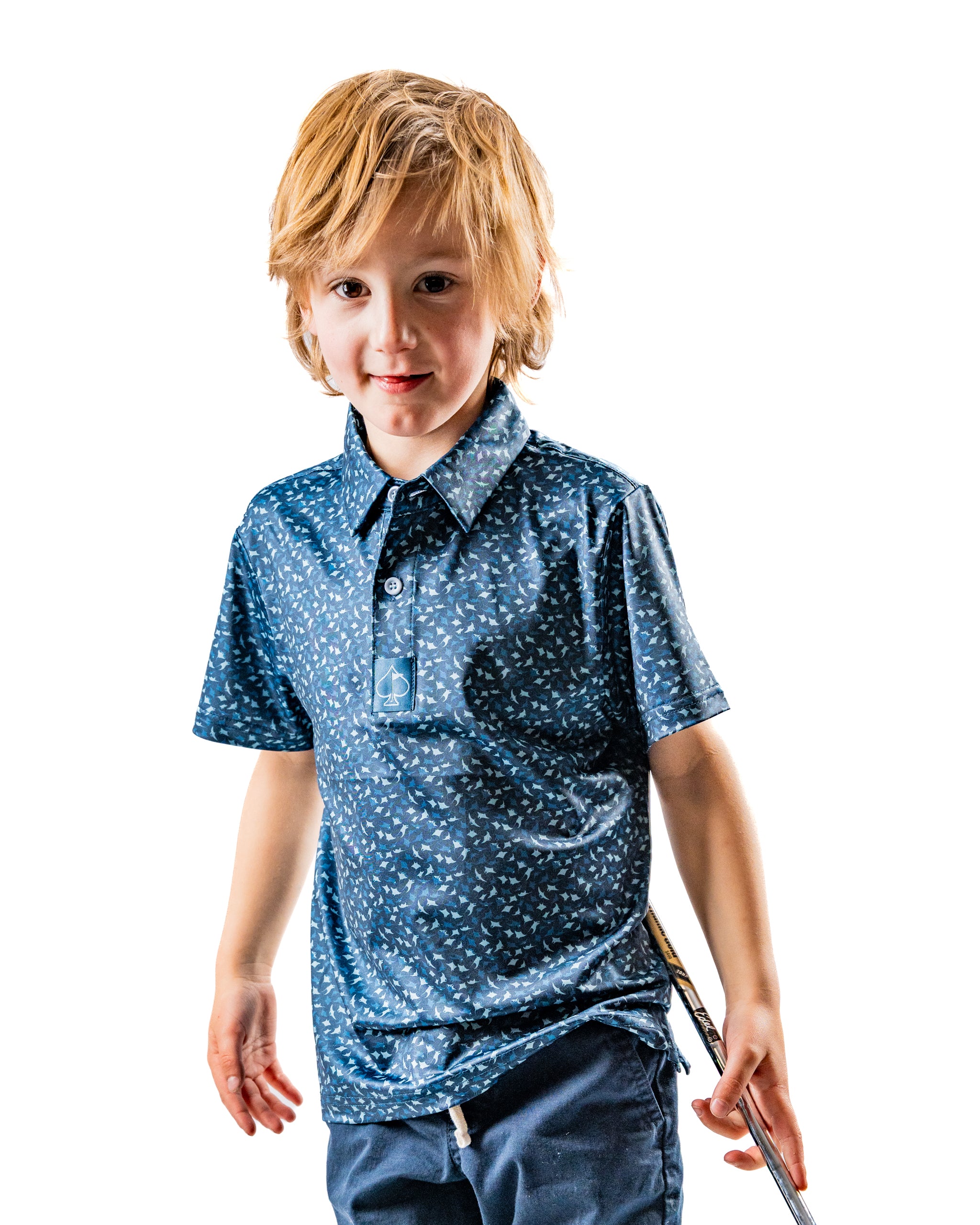 Youth Manta Ray shirt featuring a playful blue pattern, perfect for young golfers looking to stand out on the course.