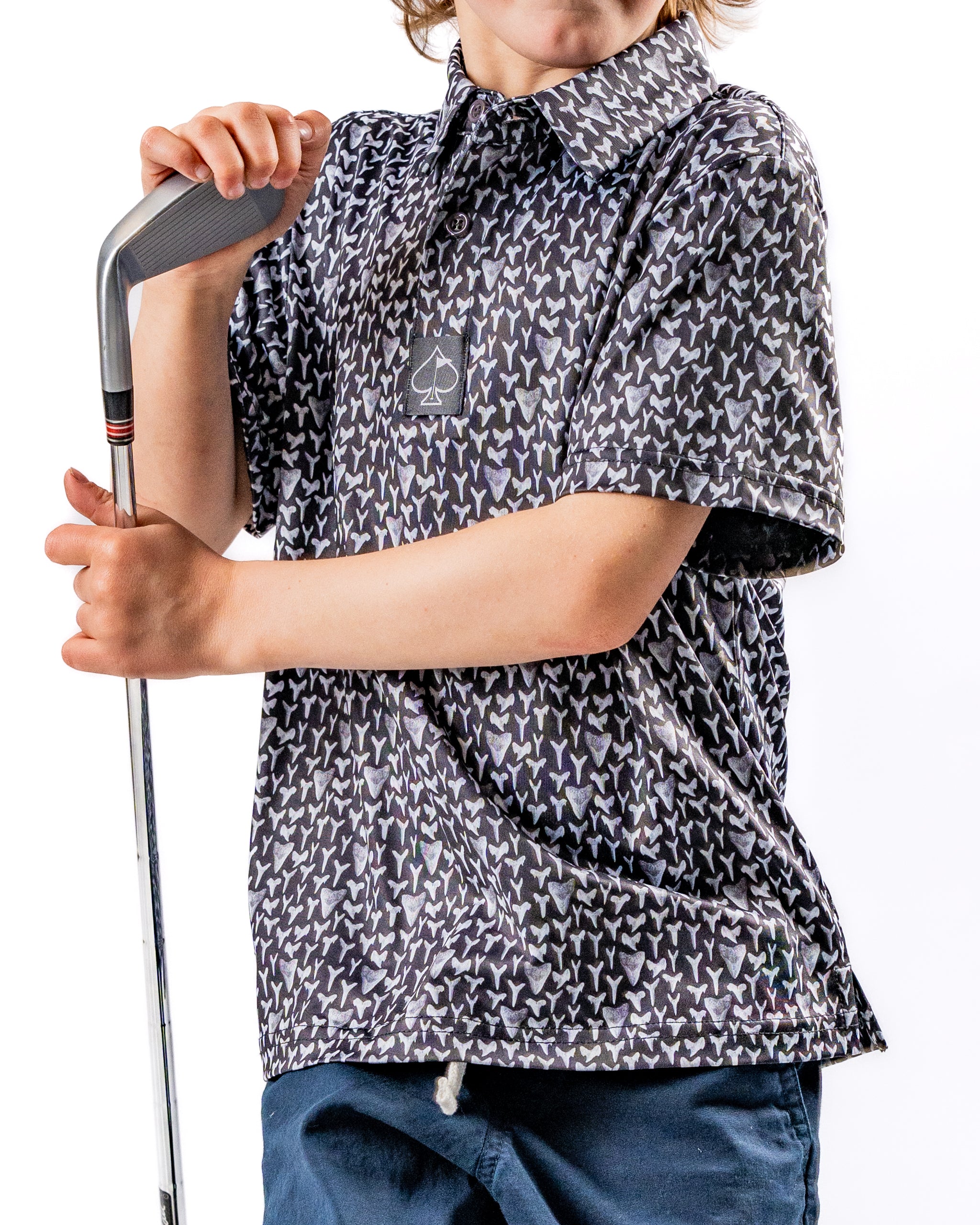 Youth Shark Tooth golf shirt featuring a playful shark tooth pattern, perfect for young golfers looking to stand out on the course.