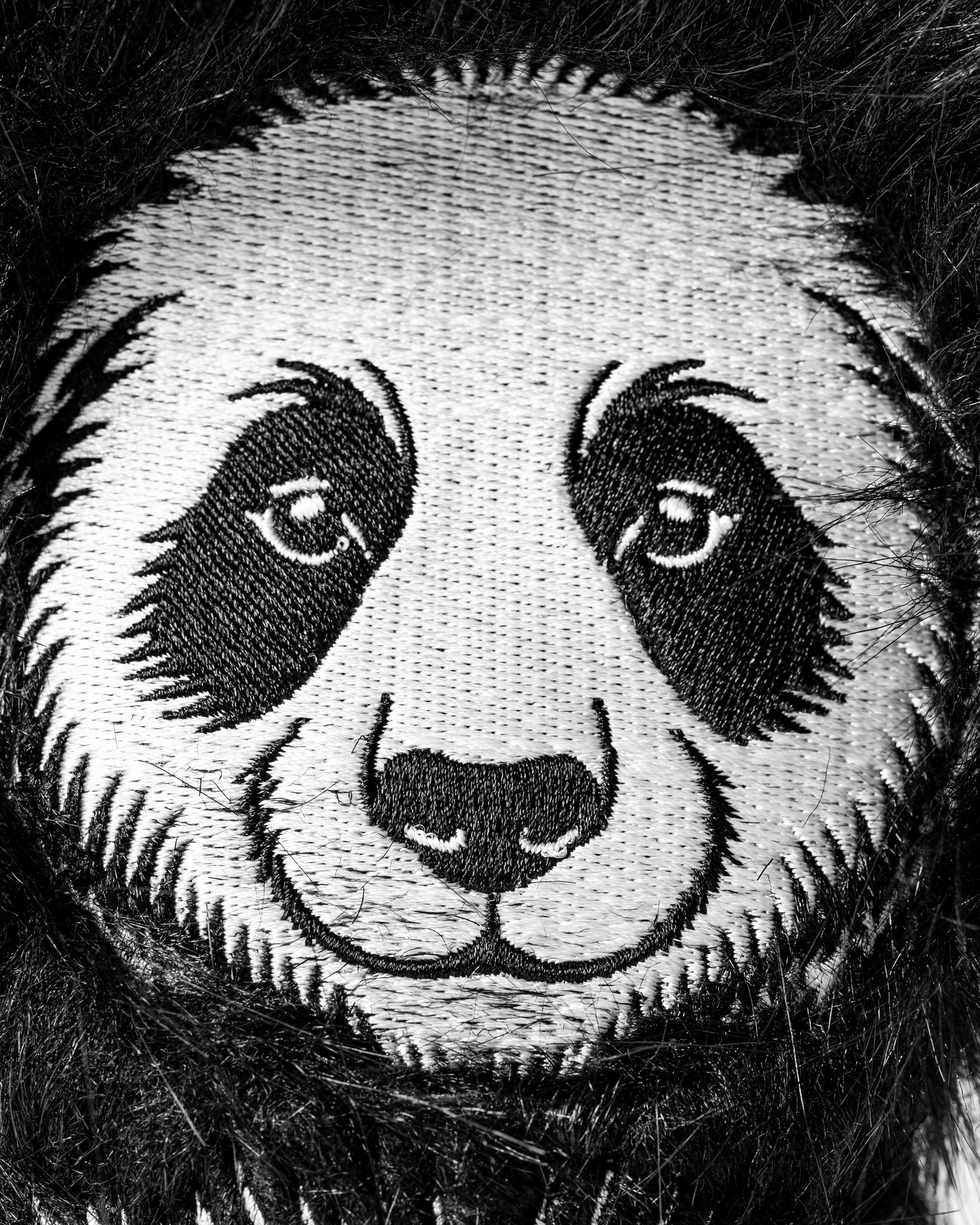 Panda hybrid golf headcover featuring a detailed embroidered panda face, perfect for adding personality to your golf bag.
