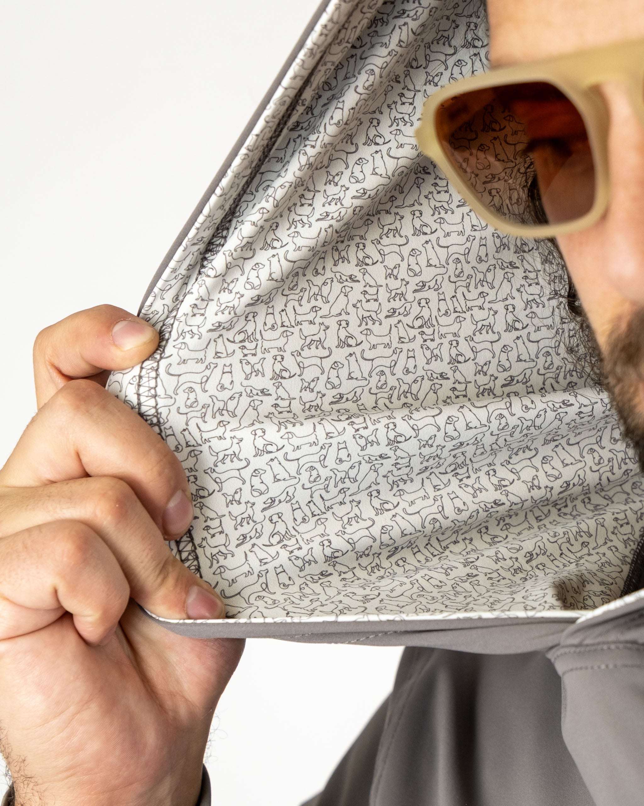 Men's performance golf hoodie featuring a playful dog print lining, perfect for stylish golfers who love their pets.