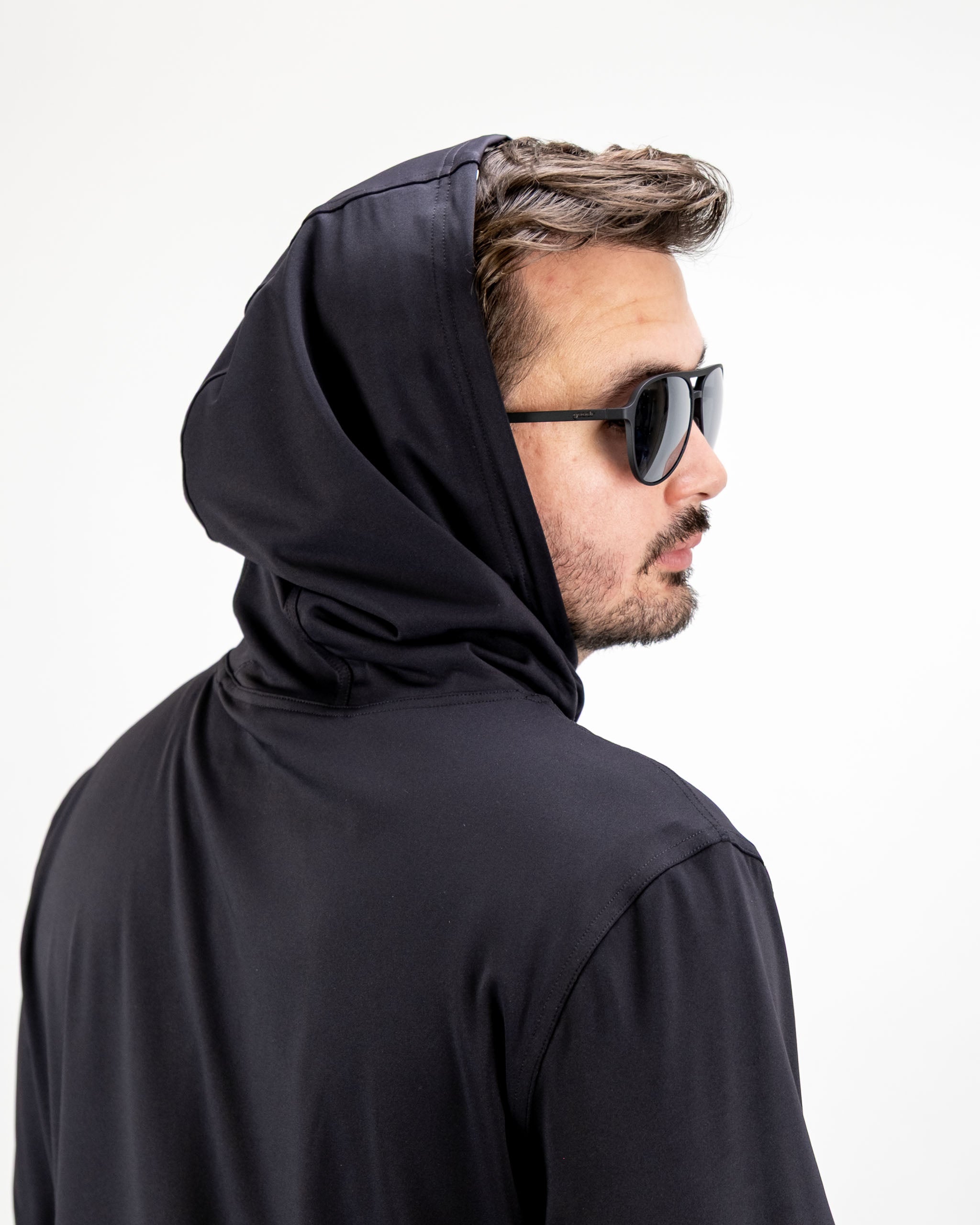 Men's performance golf hoodie in black, featuring a sleek design and hood, ideal for stylish comfort on the course.