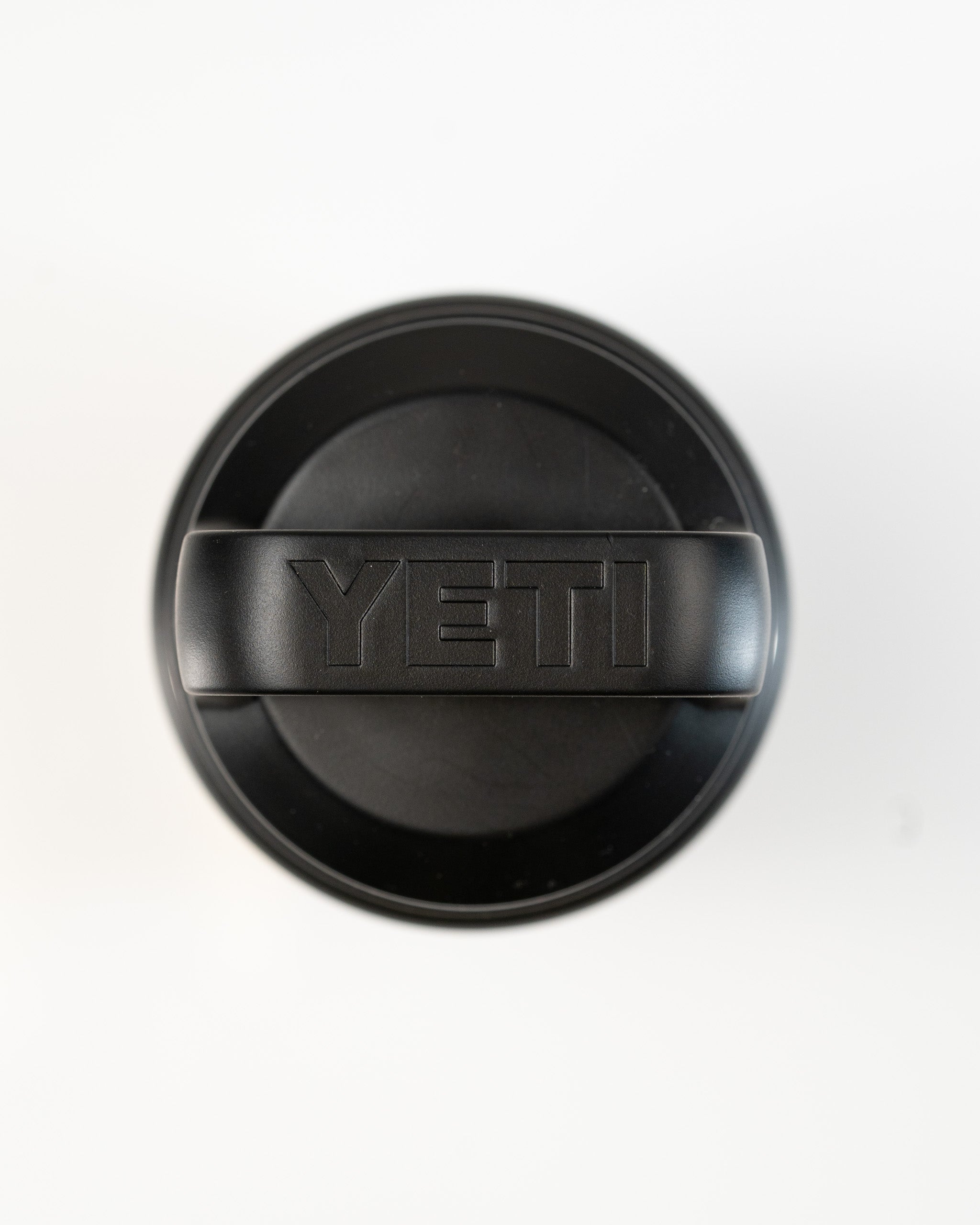 Top view of a black Yeti Rambler with a Chug Cap, featuring the Yeti logo prominently on the lid.