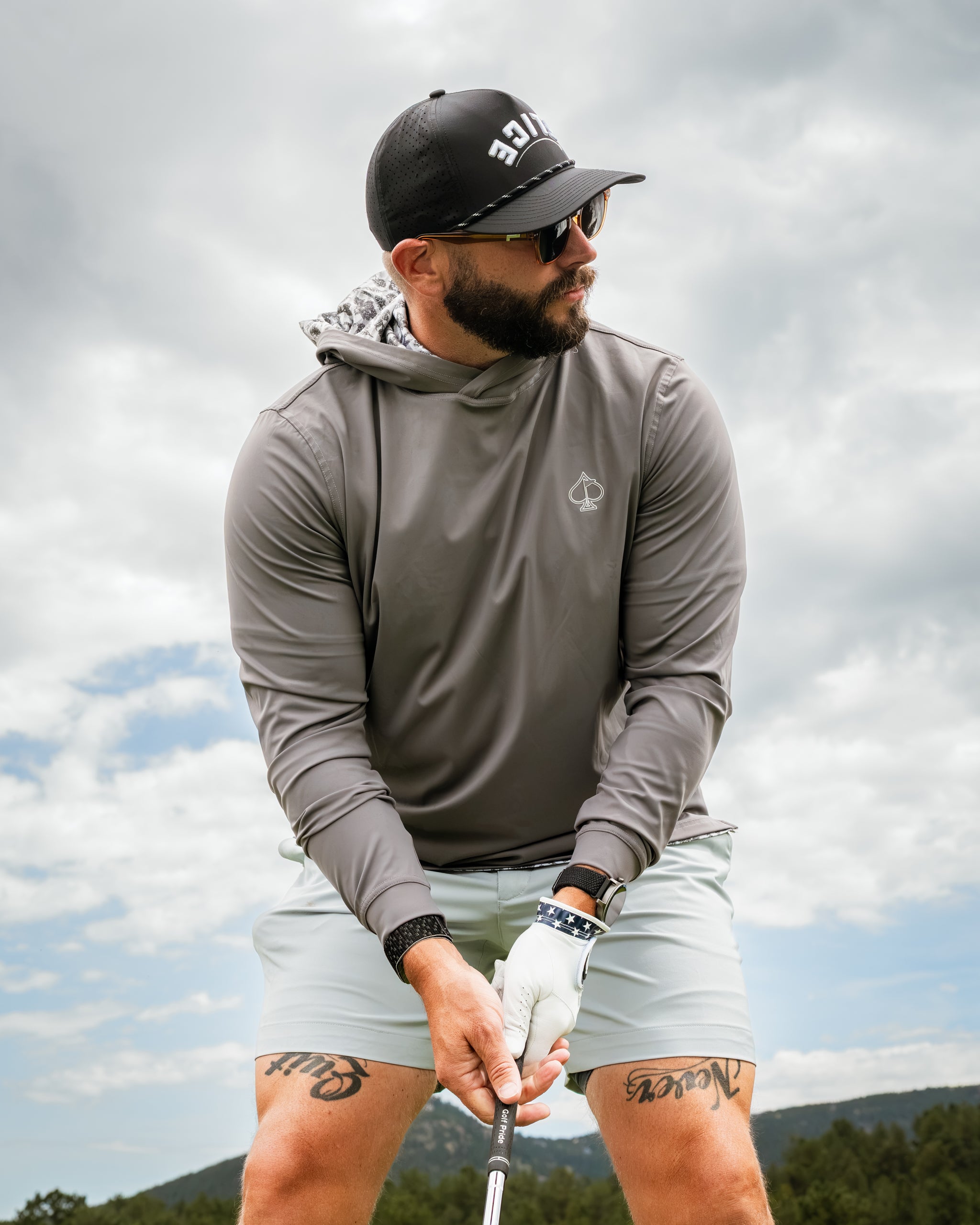Performance Golf Hoodie in Hops & Barely, worn by a golfer preparing to swing, showcasing a stylish and functional design.