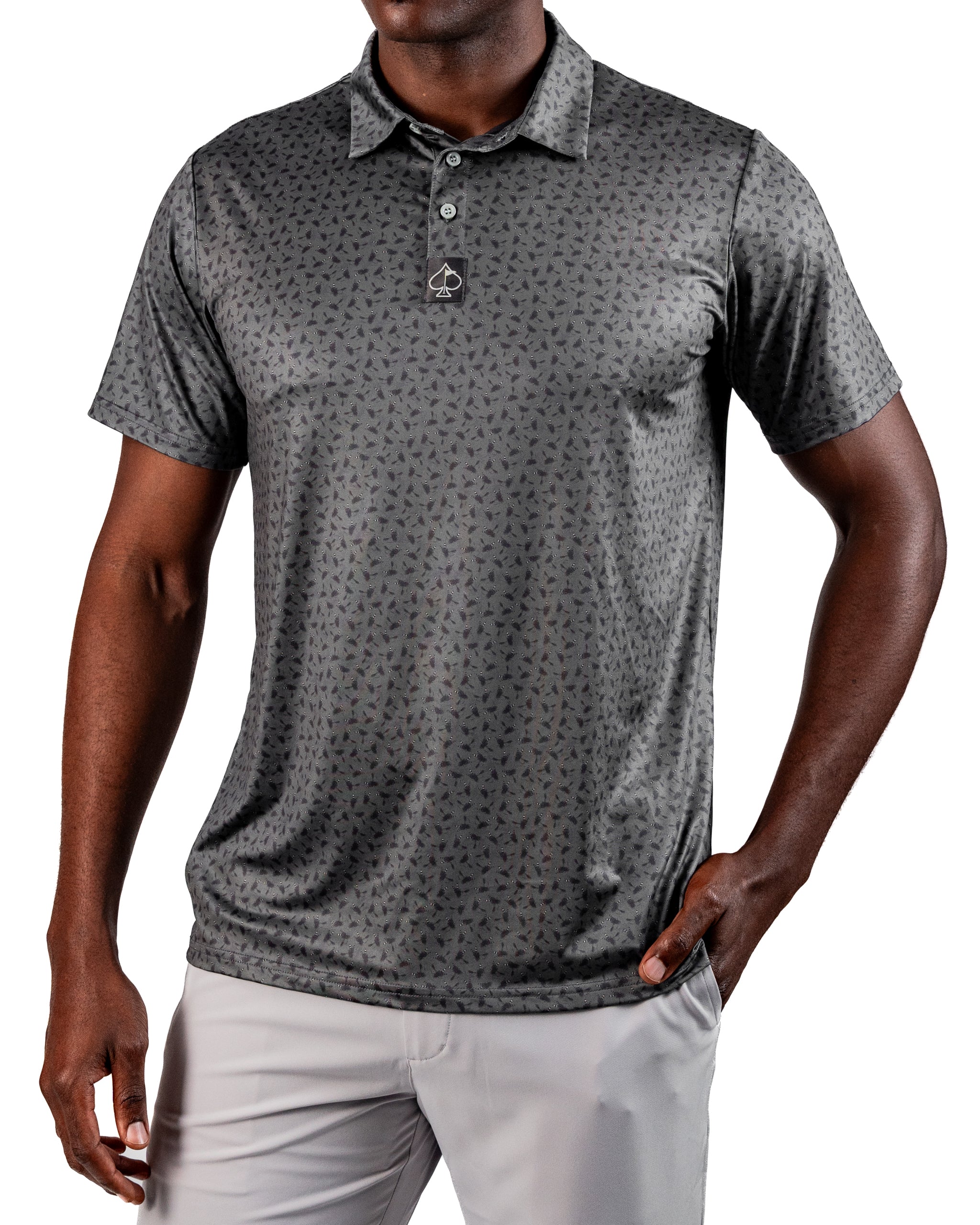 Men's Dry Fly golf polo in dark gray with a subtle pattern, designed for comfort and style on the course.