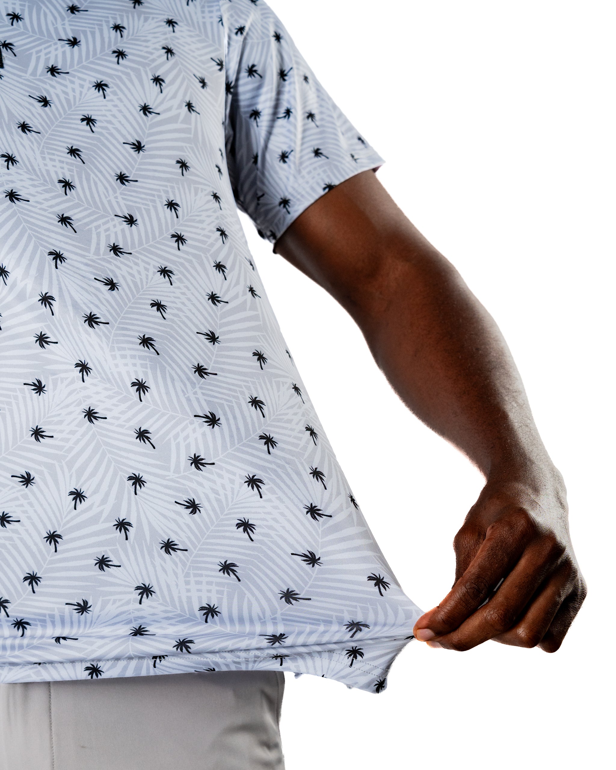 Men's golf shirt featuring a light blue palm tree pattern, designed for a stylish and comfortable on-course look.