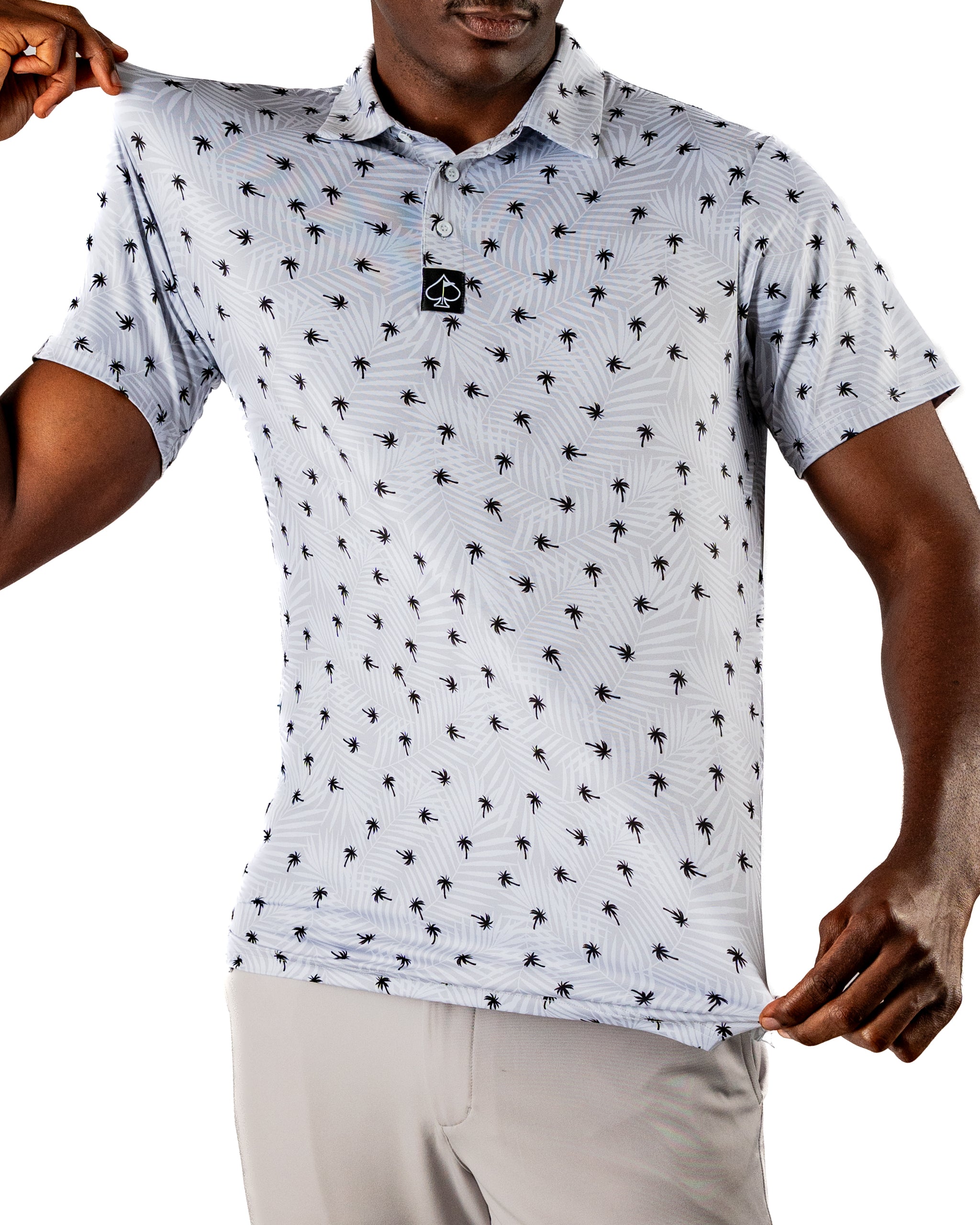 Men's golf polo featuring a light blue palm tree pattern, designed for comfort and style on the course.