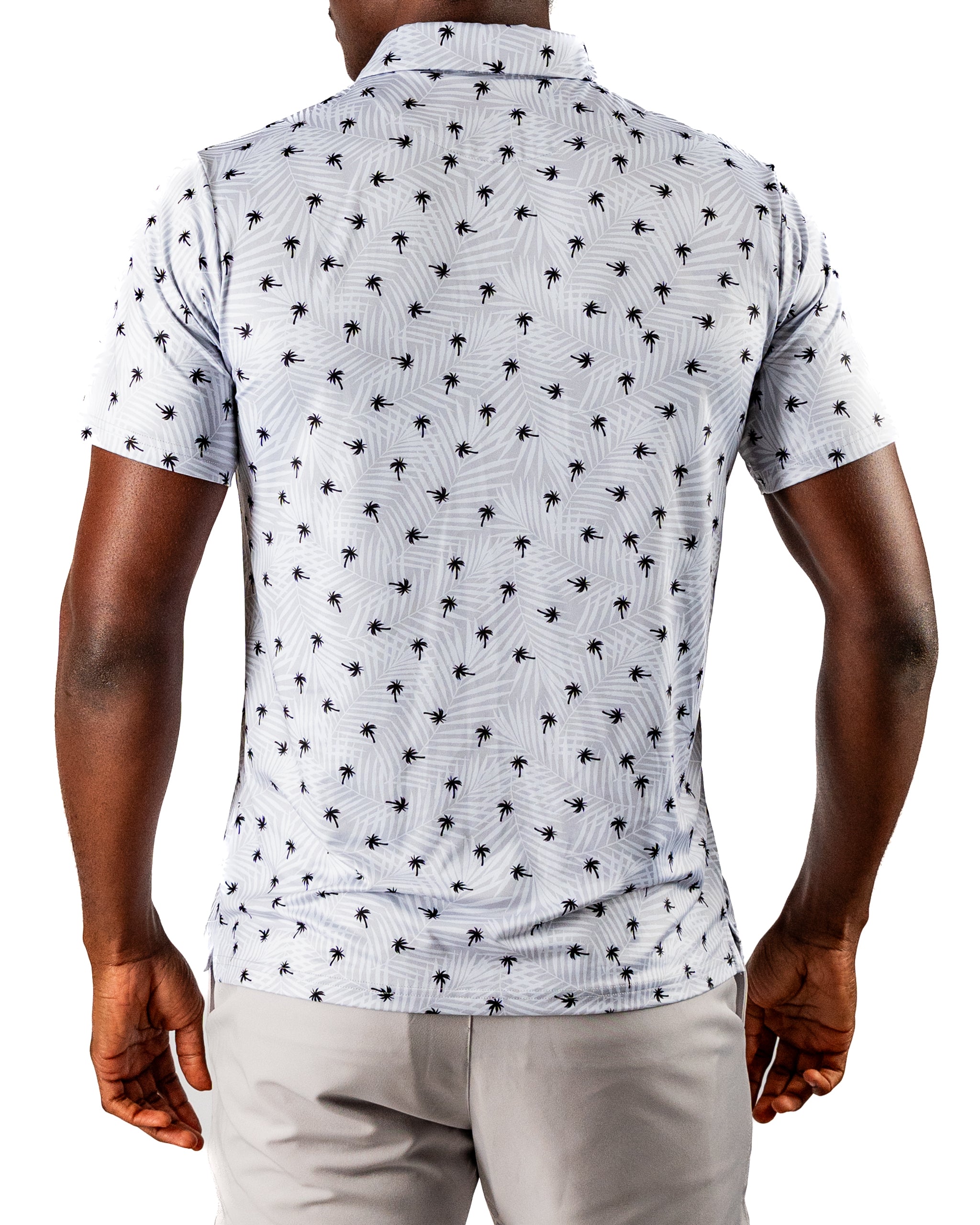 Men's short-sleeve golf shirt featuring a stylish palm tree pattern on a light background, perfect for a bold look on the course.