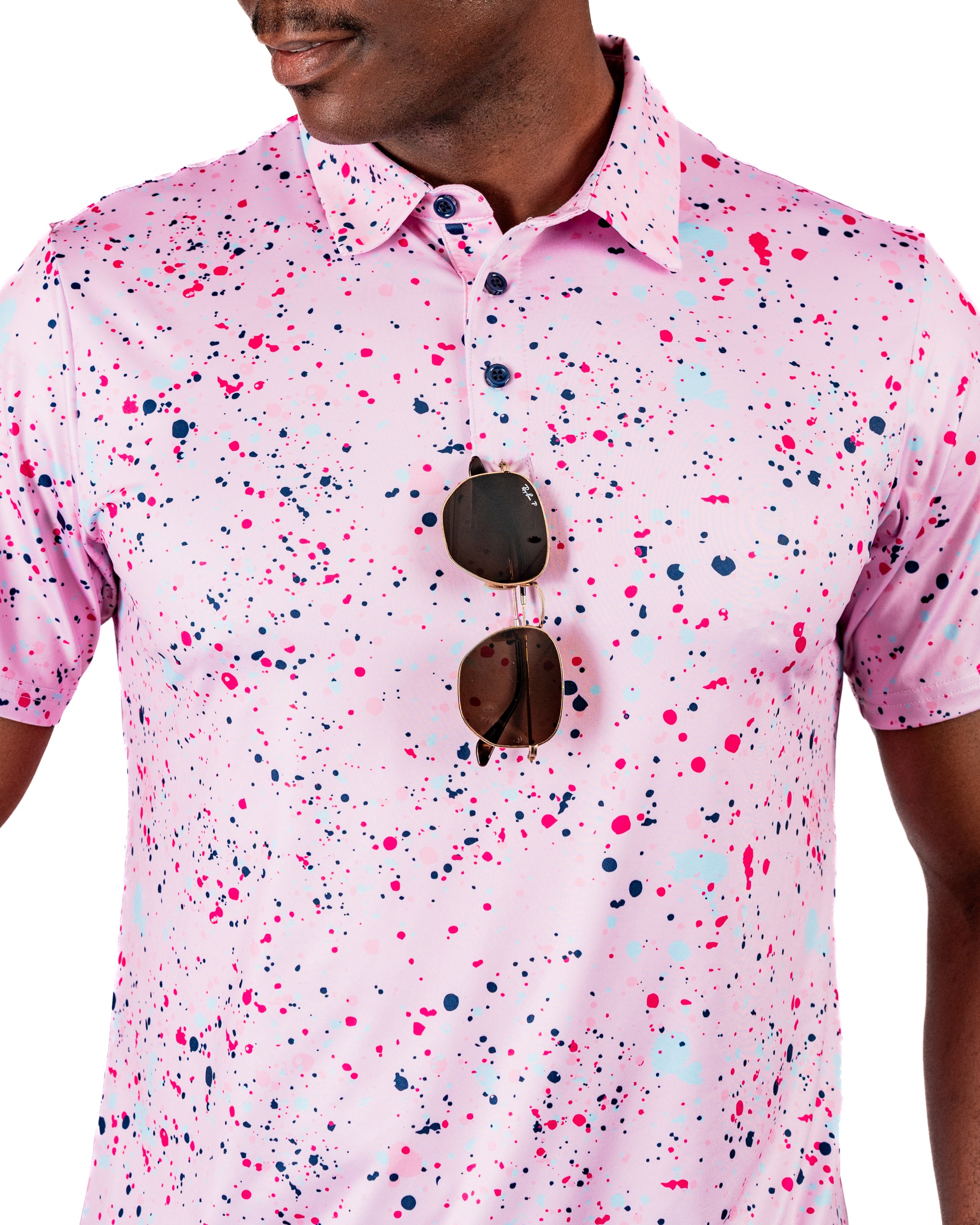 Men's pink splatter golf polo featuring a vibrant design with colorful paint splashes, perfect for stylish performance on the course.