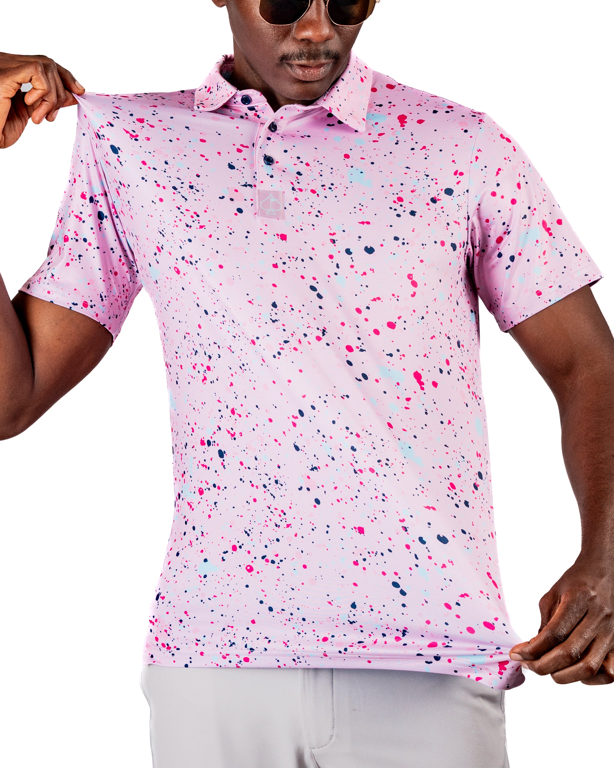 Men's pink splatter golf polo featuring a vibrant design with colorful paint-like patterns, perfect for stylish golfers.