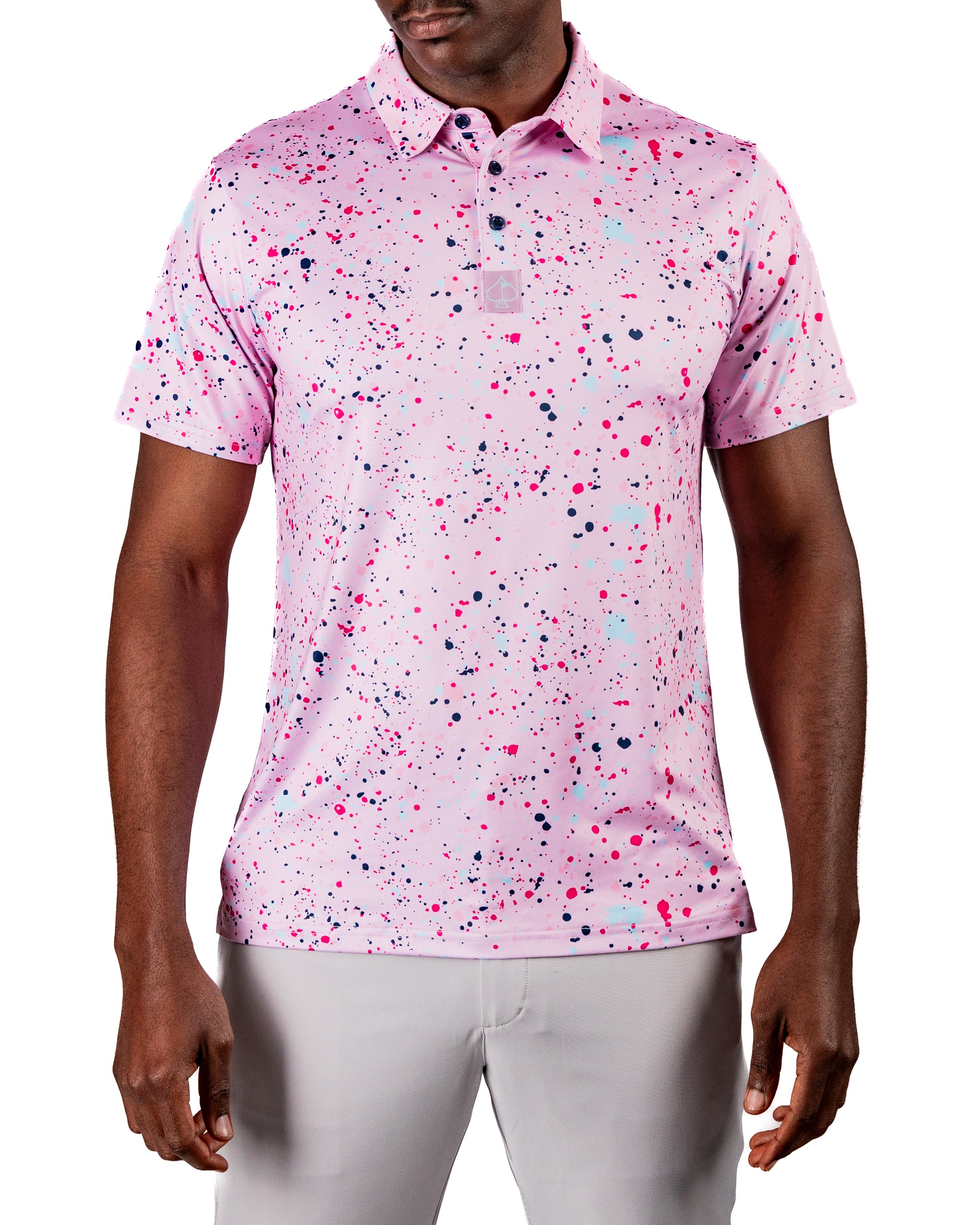 Men's pink golf polo featuring a vibrant splatter design in various colors, perfect for making a bold statement on the course.